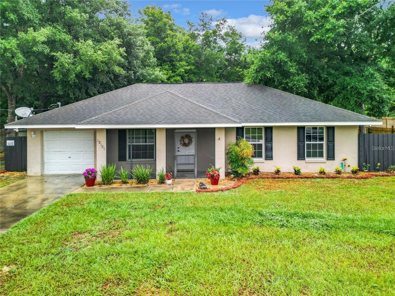 PRICE REDUCTION!! Nestled in a serene, HOA-free neighborhood, enjoy peace and privacy while still being close to all the amenities Belleview has. This charming home features 3 bedroom 2 bath, with fresh interior paint and landscaping. Just off the dining and through the French Doors is your spacious fenced in backyard with screened in porch. Whether enjoying a morning cup of coffee on the front porch or hosting a barbecue with friends in the backyard, this home embodies the perfect blend of comfort,style and serenity. The utility room features a side door leading to the outside with an additional bonus room, possible office space,playroom.or quiet area. Minutes away from Belleview, Downtown Ocala and close to the Villages. Home located 10 minutes from beautiful Lake Weir, enjoy boating, have a picnic and swimming, more than one restaurant by the lake. Stainless steel refrigerator 2022, Stainless steel dishwasher 2023. New AC unit and handler 2022. As you can see this property is priced to sell and move in ready. Only blocks away from Belleview Beltway, also known as the Southeast 92nd loop. Home warranty will be given at closing up to $450.00.