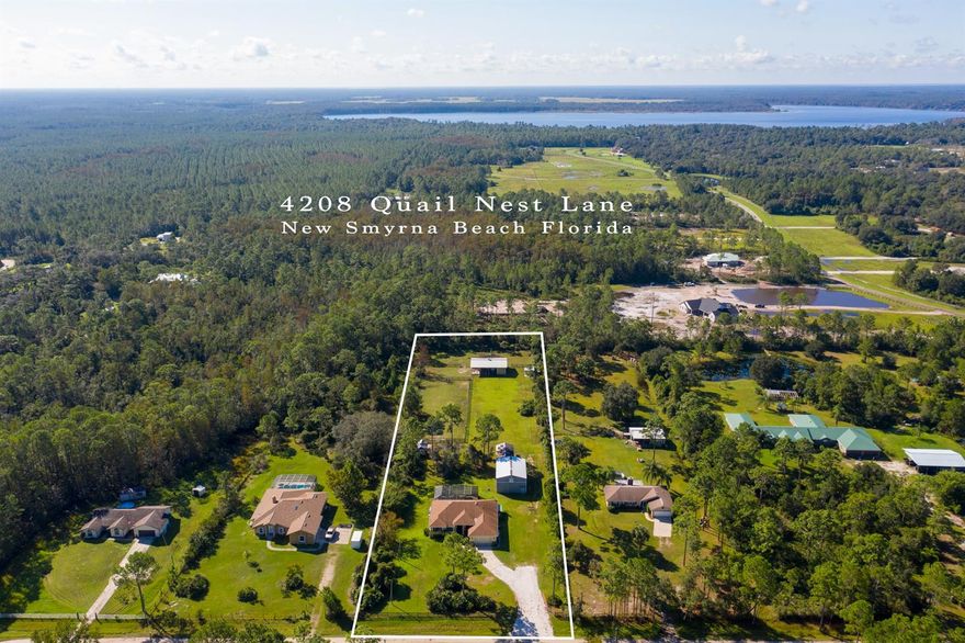 Looking for some peace and quiet, then look no further than this Equestrian Ranch Home located in the secluded neighborhood of Quails Roost Ranches.  This custom block home is situated on 2.5 cleared acres.  Room for your family in this large 3 bedroom 2 bath home with separate den. Upon entry will fall in love with the vaulted ceilings, ceramic tile floors, formal dining area, living room over looking the screened in pool and separate family room. Your gourmet kitchen is a Chef's dream. The gas range has dual oven/warming drawer.  Plus a separate double oven was installed as well.  Updates include granite counters, tile backsplash, tall Kraftmaid wood cabinets and walk in pantry. You even have an added Butlers Pantry or coffee bar. Relax in your large master bedroom, with modern ship lap wall, custom walk in closet and sliding glass doors to the pool. You will be wowed by your updated and stylish master bath with dual vanity, tub and walk in shower.  Entertain friends outside by the large 40 x 42 screened in pool with pavers and waterfall feature. New pump and filtration for the pool 2 years ago. Your 2.5 acre property is fenced and boasts a 4 stall barn with turnouts, round pen, equestrian arena, tack room as well as a chicken coop.  Also included is a large 30 x 40 workshop/garage with loft space, 3 large sliding doors and enclosed work space with AC.  Great for the car enthusiast, word worker or any other hobbies.  This home offers 500 gallon buried LP tank, whole home generator, 2019 new submerged well and pump, top of the line water softner and filtration system, RV parking with 30 amp power and water, storm shutters, new garage door and opener, video surveillance and much more.  Newer AC with UV light and HEPA filter.  Roof 2012.  If you have been thinking about a mini-ranch in a quiet country setting, yet close enough to NSB, Port Orange and Orlando, don't let this one pass you by.  All measurements deemed accurate.  Buyer should verify on their own. ;Water: Available at Site