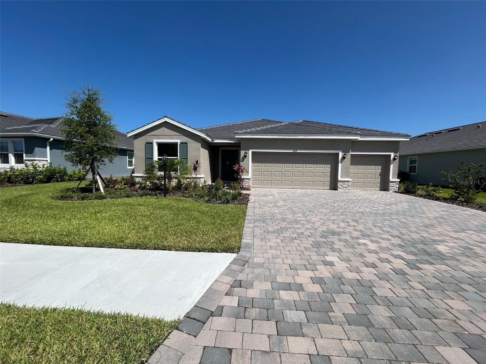 MOVE IN READY! REDTAG SALE: Receive up to $25,000 towards closing costs and special interest rates with the use of our preferred lender Now to July 31st. Self-guided tour available on this quick move-in home every day from 7am-9pm. Stop by to tour on your own time. Star Farms at Lakewood Ranch is D.R. Horton's premier destination located in the award-winning master-planned community of Lakewood Ranch. Set within Southwest Florida's natural beauty and close to many popular area attractions, this 700-acre gated neighborhood will consist of 1,500 single-family homes, townhomes, and paired villas, all designed to meet the needs of today’s modern family. Star Farms is debuting our new Express Modern Series homes, ornamented with chic, contemporary exteriors and complete with matching trendy interior finishes. All homes will include luxury vinyl plank flooring in the main living areas, quartz countertops throughout, stainless steel appliances, and much more! All of our homes feature all-concrete block construction on the first and second floors and D.R. Horton’s state-of-the-art Smart Home Automation system. The first phase of The Resort Club amenity center is NOW OPEN, including Trade Route Coffee Kitchen, Resort Style Pool, Fitness Center, Athletic Performance Center, and Pet Park. Future phases of The Resort Club will include a Poolside Bar & Grill, Outdoor Activities Area, The Event Center, and The Terrace Chef’s Patio. Future amenity centers, Junction Place & Cabana Corner, will include a Baseball Field, Tennis, Pickleball & Basketball Courts, Golf Cart Parking, Playground, Clubhouse, Resort Pools & Splash Pad, Poolside Cabanas, Sand Volleyball, Poolside Grilling, Pet Park and more. Let America’s #1 Builder help you attain your piece of The Ranch at Star Farms at Lakewood Ranch.