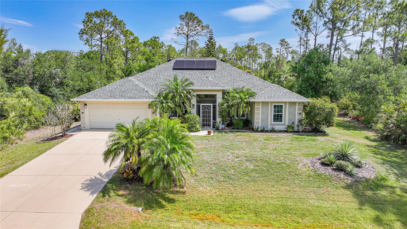 Nestled in a peaceful North Port neighborhood, this charming 3-bedroom, 2-bathroom home with a bright and airy ambiance is enhanced by contemporary upgrades. This perfectly updated home provides abundant space, unparalleled privacy, and limitless possibilities. No flooding in previous hurricanes, property sits high and dry. Inside, the open-concept design showcases soaring cathedral ceilings and an abundance of natural light, creating a spacious and inviting atmosphere. The newly renovated gourmet kitchen boasts luxurious quartz countertops, top-of-the-line appliances, elegant cabinetry, and an updated reverse osmosis system, perfect for culinary enthusiasts. Step outside to the enclosed, screened-in back patio, leading to a tranquil backyard with mature landscaping, featuring a soothing hot tub, a charming brick paver seating/dining area, and a wrap-around sidewalk—ideal for relaxation and entertaining guests.
Key features include:
• Brand-new roof installed in 2023, complete with solar attic fans.
• Owned solar panels with whole-house battery backup, ensuring power during outages and the ability to sell excess electricity back to the grid, reducing monthly bills to an average of just $35.
• Hurricane impact windows and shutters, provide peace of mind during storm season.
• Mature landscaping creating a lush and private oasis.
• Versatile office space that can easily be converted into a fourth bedroom
• Both the side lot and the lot across the street are available for separate purchase!
Conveniently located near I-75, this home offers easy access to Sarasota, Tampa, Fort Myers, and Naples, along with proximity to stunning beaches, shopping, dining, and recreational facilities.
Do not miss the chance to own this beautifully updated home. Contact us today to schedule a viewing and discover the endless potential this property has to offer.