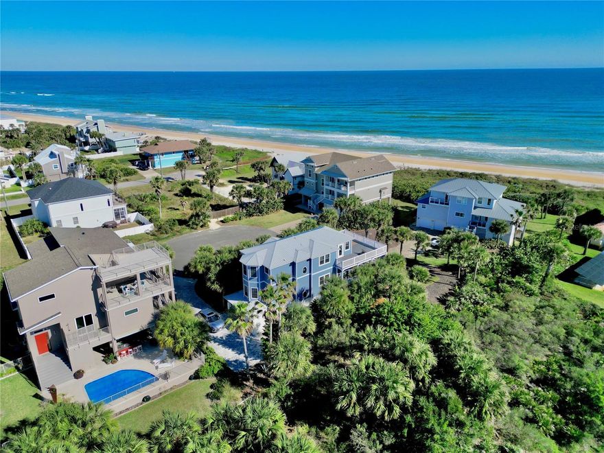 Set within the coveted Hammock area of Palm Coast, 56 Seascape Drive offers an easygoing coastal lifestyle defined by quiet streets, ocean breezes, and life just steps from the sand. Located only 50 yards from the beach on a peaceful cul-de-sac in Marineland Acres, this quiet street does not allow short-term rentals, providing a private, residential atmosphere. The Seascape community offers private beach walkover access, further enhancing the convenience and exclusivity of this beachside setting. This 5-bedroom, 4-bath, three-story residence delivers privacy, comfort, and sweeping ocean views in one of Flagler County’s most naturally preserved communities.
Surrounded by mature palms and unspoiled landscape, the home reflects the relaxed pace of The Hammock—where days are shaped by sunrise walks on the beach, outdoor living, and a strong connection to nature. Multiple decks capture coastal breezes and ocean views, creating ideal spaces for entertaining or unwinding.
The top level serves as a private owner’s retreat, featuring a spacious primary suite with dual vanities, an oversized walk-in shower, generous closet space, and a private ocean-view sun deck. An additional en-suite bedroom, a sitting area, and a charming window seat complete this level.
The main living level offers an open, inviting layout with a well-appointed kitchen featuring granite countertops, solid wood cabinetry, stainless steel appliances, and a gas range. Dining and living areas flow seamlessly to a covered deck, while a gas fireplace adds warmth and ambiance. An additional en-suite bedroom and laundry room provide everyday convenience.
The ground level includes two additional bedrooms—ideal for guests, a home office, or multi-generational living—along with an oversized two-car garage with ample storage for beach and outdoor gear.
Recent updates include Hardie® board siding (2025), metal roof (2018), two water heaters (2018 & 2022), sealed energy-efficient ductwork, and newer HVAC systems, making the home well maintained and move-in ready.

Situated nearly half a mile from A1A, this private cul-de-sac offers peace and quiet with no highway noise, no through traffic, and no short-term rentals, while shopping and dining are just minutes away. A rare opportunity to own a private coastal retreat with private beach walkover access in one of Palm Coast’s most desirable beachside neighborhoods.