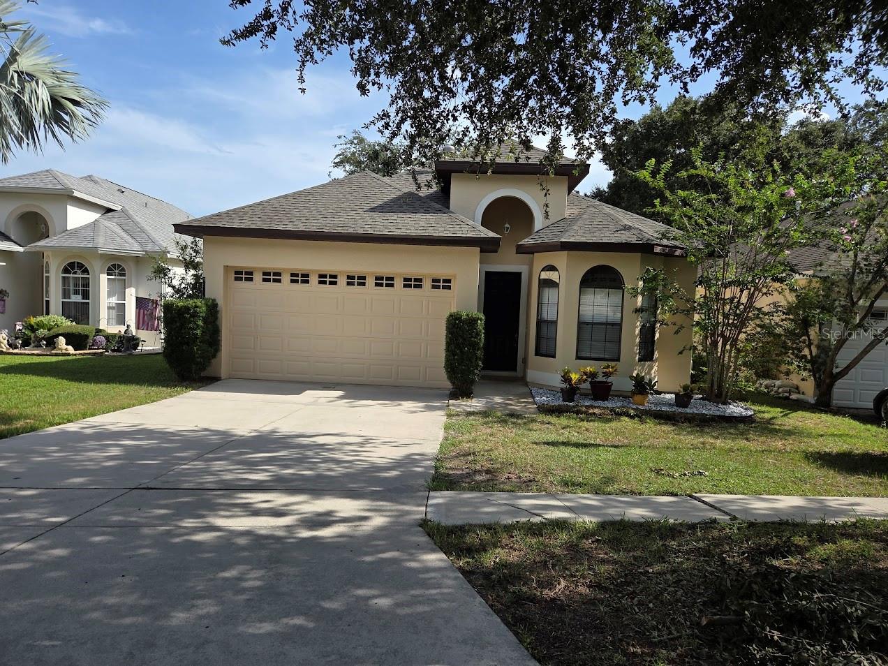 Just the right size, nearly 1500 SF and move-in ready with many updates to enjoy. New tile floors (2025), New Stainless Appliances (2025-Gas Range, Dishwasher and Microwave), AC (2024) Roof (2022). Gated Small Neighborhood with low HOA fees. For hot days, enjoy the community pool. There is a private fenced backyard and a covered porch to enjoy your outdoor space. The Kitchen includes Corian countertops and 42" cabinets. The owner's suite has a walk-in closet, garden tub, toilet closet, a walk-in shower, his and her sinks and a large linen closet. With a split floorplan, the second and third bedrooms are away from owner's suite. The second bedroom has a walk-in closet. There are 10 foot ceilings throughout, and the doors are over 8 feet tall, so bring those larger pieces of furniture. Enjoy great schools (Treadway Elementary, Tavares Middle and Tavares High). The Owner's circumstances have changed so this means a beautifully updated home, priced to sell. Owners can close quickly so schedule today and discover all the many reasons you should live here.
