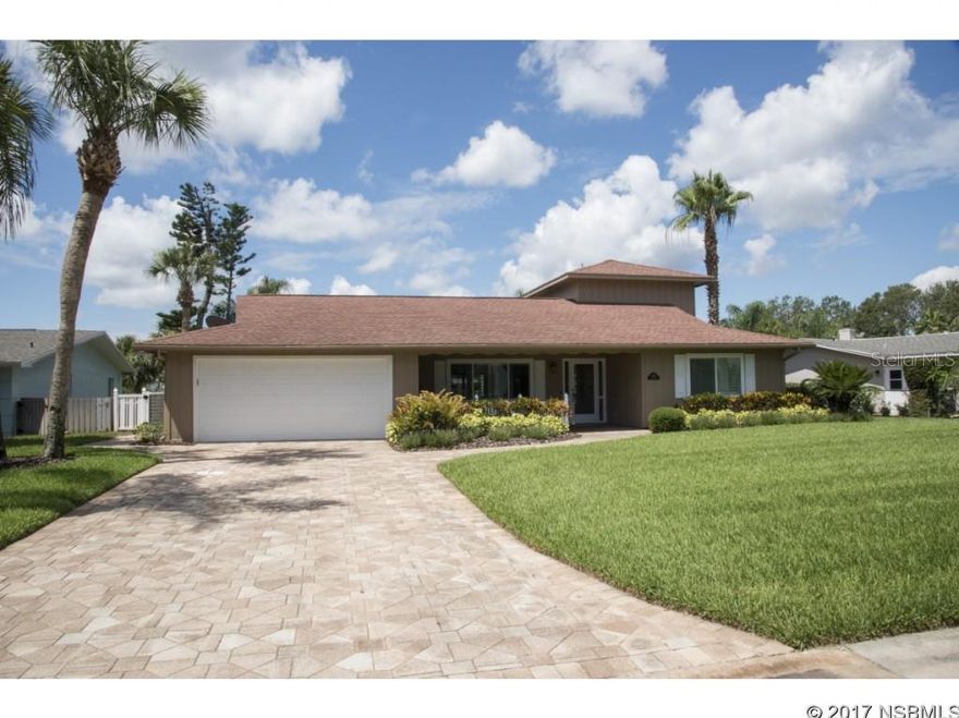 Renovated 3/2 pool home with DEEP WATER dockage in prestigious Venezia subdivision on Coronado Island. Open floor plan with complete kitchen renovation in 2016 featuring solid wood bead board cabinets, granite counter tops, stainless steel appliances, tray ceiling, plank tile and recessed lighting. Large master suite with pool and water views, Andersen tinted impact resistant sliding door with custom black out blind, his & her walk-in California closets, linen closet & shoe closet. Large master bath with whirlpool tub, dual sinks, high counter tops & tile flooring. Split floor plan with second bedroom & bath on first floor. Third huge bedroom is upstairs with walk-in closet that could easily be converted into a third bathroom with beautiful views of the water and surrounding homes...large enough to be a second master suite. Freshly painted interior & exterior with plantation shutters and e-rated impact windows throughout. A perfect for entertaining 29' x 15' family room with oak bar.