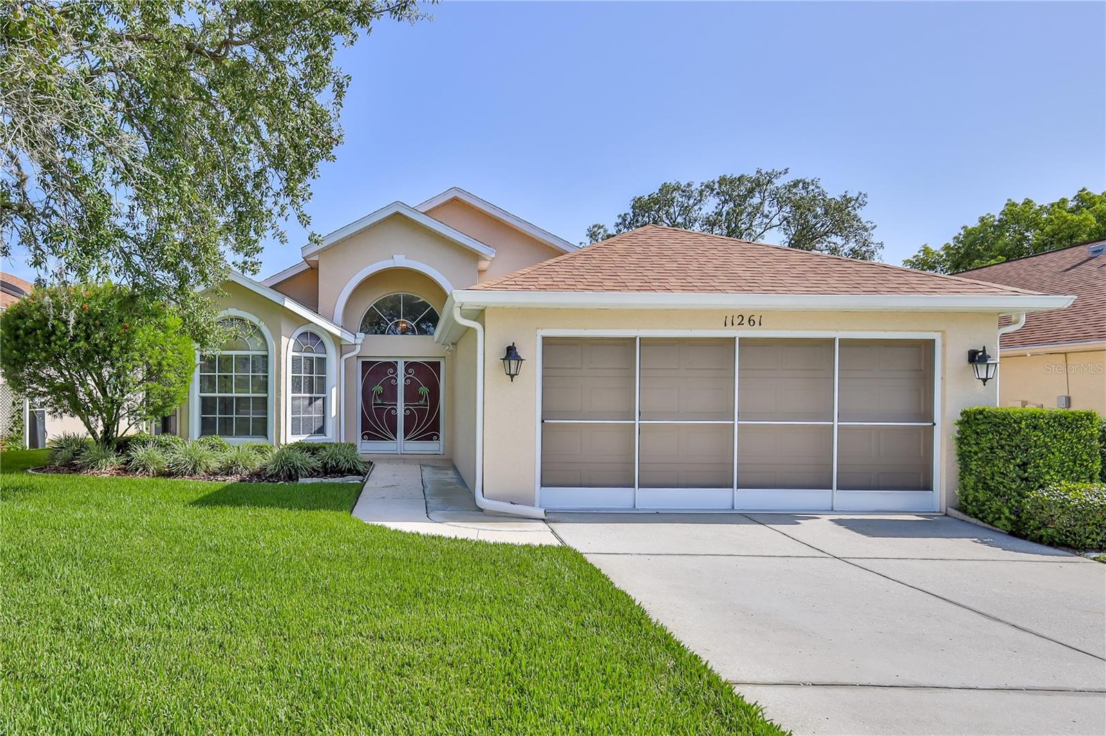 Lovely 3/2/2 in upscale 55+ Community. Tile Floors everywhere except bedrooms. Primary Bedroom has wood laminate flooring, double vanities, sweeping counterspace, Solar Tube, why turn on the lights, and a Snail Shower for ultimate convenience. Kitchen is laid out for cooking and entertaining and the nook is huge. Entry has coat closet, formal dining with bay windows doubles as den, sitting room, etc. Oversized Great Room looks out to enclosed lanai with tile flooring. Pretty garden view to enjoy while relaxing in the Florida weather.
Water Softener included. Enjoy the lifestyle.
You will enjoy the lifestyle afforded by this community with 24 hour-guard, gated, 18,000 Sq. Ft. Clubhouse with ballroom, Restaurant, Billiards, Fitness, Library, Heated Pool, Spa, Bocce, Tennis, Pickleball and more. Newly completed all new road paving. Sidewalks for walking and benches to relax on where you will enjoy the extraordinary landscaping. Your fees include, fiber optic internet, and Streaming. All just 45 minutes from Tampa and close to local beach/kayaking, fishing and local great restaurants.