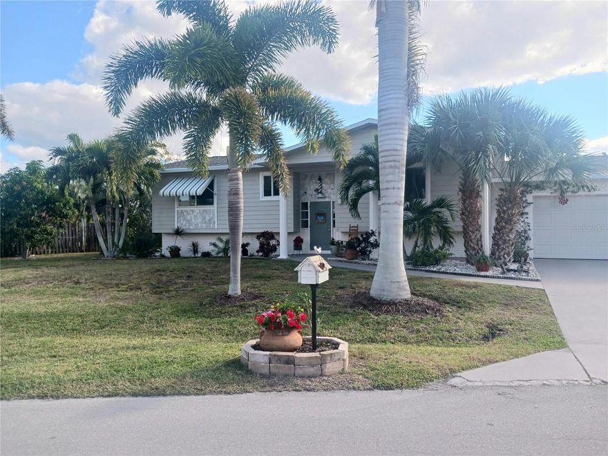 Discover this charming waterfront home located in the heart of Punta Gorda, Florida!  Light and bright layout with two bedrooms and two bathrooms, that are also ensuites for couples who like their own space, or for hosting visitors. This cottage style home reflects the 'coastal' ambiance of old Florida.  Relax in the spacious heated and air conditioned sunroom with floor to ceiling views of the waterfront that heads out to Charlotte Harbor (2 bridges to bay).  Minimum restrictions in this conveniently located subdivision, Charlotte Park,  makes it possible to store your RV, and the oversized 2 car garage has plenty of room for vehicles and 'toys'.  House has older but sizeable fishing dock eliciting memories of 'Flipper', and a working boat lift if you dream of boating in Florida!  Wider hallways and doorways, plus lower light switches make this one a good choice for someone in a mobility chair.  Head downtown or to the waterfront on foot or bike in this quaint waterfront town with plenty of activities year-round.  Ask how inexpensive it can be to live in this peaceful home that can come fully furnished, and with a 2 year transferrable FEMA flood policy.  Moving back home after this wonderful chapter of our lives!