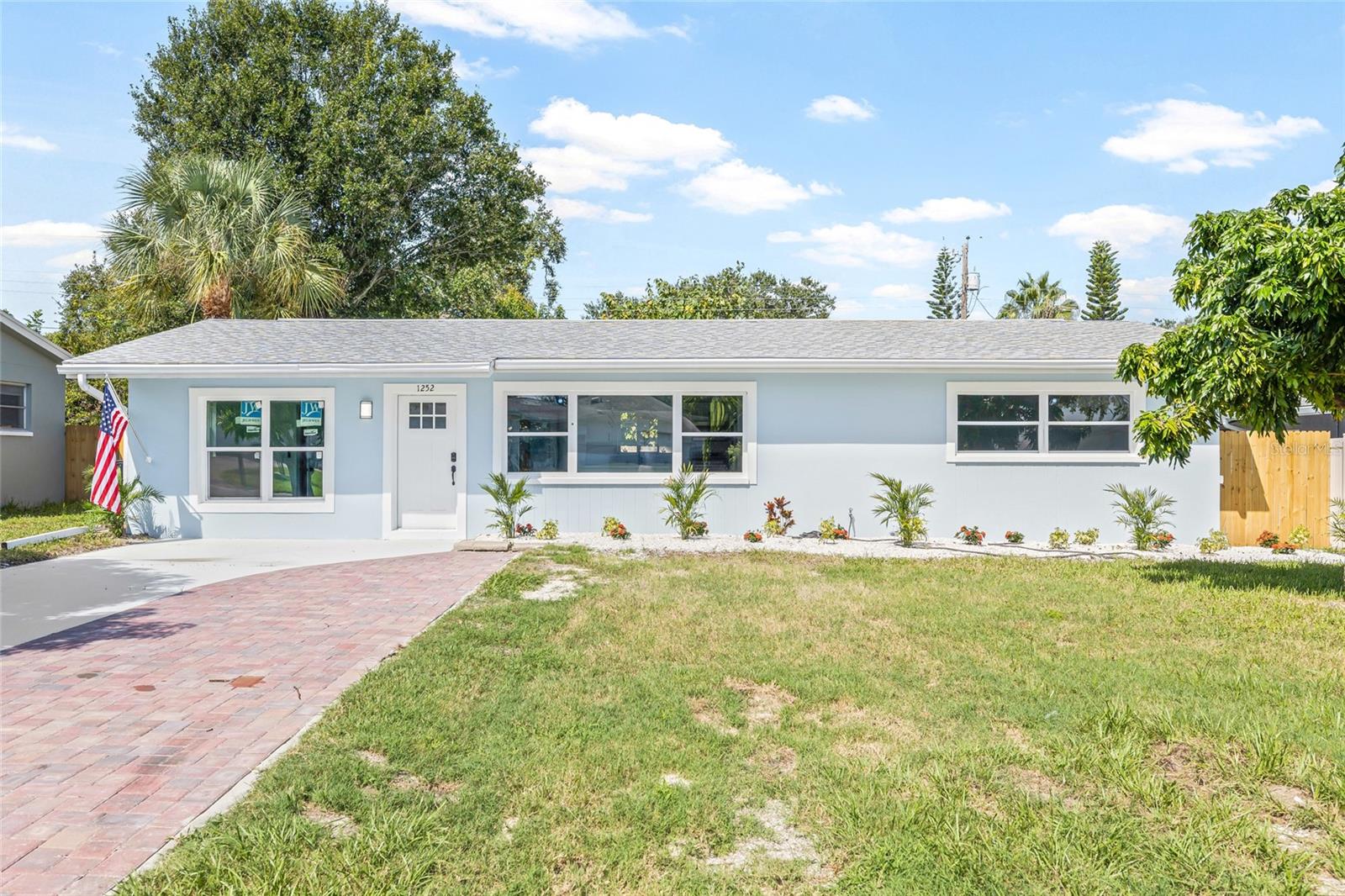 Welcome to your beautifully renovated Clearwater home! This 3-bedroom, 2-bathroom gem is truly move-in ready and designed for modern Florida living. From the moment you arrive, you’ll appreciate the inviting entry and charm of this home. Step inside to a bright, open floor plan where large new windows fill the living and dining areas with natural light, creating a warm and welcoming atmosphere. The stunning kitchen is a true highlight, featuring sleek countertops, brand-new cabinetry, stainless steel appliances, and a functional island with bar seating—perfect for casual meals or morning coffee. The split floor plan offers privacy, with two comfortable guest bedrooms and a stylish full bath on one side, and a spacious primary suite with an updated ensuite bath on the other. This home also provides peace of mind with a 2021 roof, a new water heater (2025), and upgraded windows with a new sliding glass door. Outside, the large backyard is ideal for entertaining, play, or relaxation, and a storage shed adds extra convenience. Perfectly located just 10 minutes from the Gulf beaches, 25 minutes from downtown St. Pete, and close to fantastic shopping and dining, this home combines comfort, convenience, and the best of the Florida lifestyle. Don’t miss your chance to make this Clearwater treasure yours—schedule your showing today!