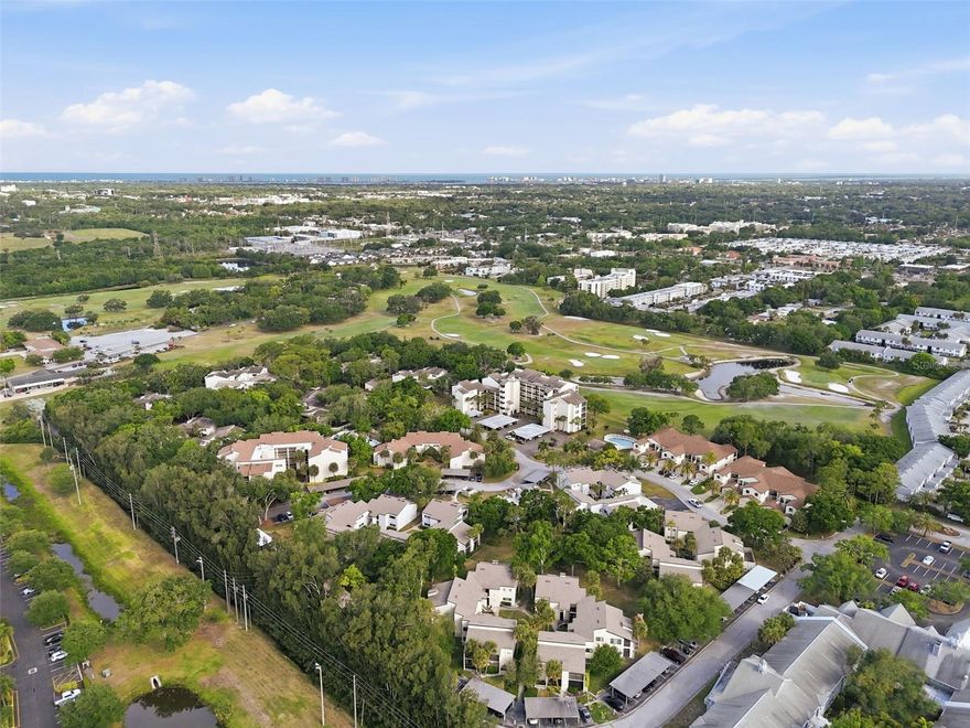 Welcome to this beautifully maintained two-bedroom, two-bathroom condo in the Forestbrook community of Largo, perfectly positioned on the second floor with peaceful golf course views. This light and bright residence offers a spacious open floor plan, beginning with a welcoming foyer that flows seamlessly into the main living areas. Inside, you’ll find durable 12mm laminate flooring with cork underlayment throughout, enhancing both comfort and style. The combined living and dining room is ideal for everyday living and entertaining. It features large windows that fill the space with natural light and sliding glass doors leading to a wraparound porch with panoramic sliding enclosures; perfect for enjoying the view year-round. The kitchen is well-appointed with stone countertops, stainless steel appliances, and an abundance of wood cabinetry, offering plenty of storage and workspace. The split bedroom layout provides privacy. The spacious primary suite includes its own private screened-in porch, a walk-in closet, and a well-equipped en-suite bathroom featuring dual vanities, a jacuzzi tub, and a separate shower. The second bedroom is nicely sized and conveniently located near the guest bathroom, which includes a tub/shower combination. Additional features include an in-unit laundry room with washer and dryer hookups. Residents of Forestbrook enjoy access to a community pool and a prime location just minutes from East Bay Golf Club, Largo Central Park, and the many dining and shopping options along East Bay Drive. Plus, you’re less than 20 minutes from the beautiful Gulf beaches, including Belleair Beach. This condo offers the perfect combination of comfort, convenience, and scenic surroundings - ideal for full-time living or a seasonal retreat. Schedule your showing today!