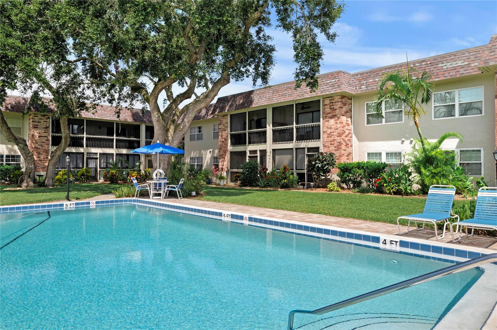 Live where beach days and river sunsets are part of the routine. This beautifully refreshed 2-bedroom, 1.5-bath ground-floor condo sits minutes from the Atlantic shoreline and the calm Indian River—prime territory for morning walks, kayak launches, and evening waterfront dinners. Inside, the kitchen steals the show with crisp white Shaker cabinetry, quartz countertops, a designer tile backsplash, and stainless steel appliances. The two bedrooms are nicely sized; the primary features a walk-in closet and an upgraded private half bath, while the full hall bath is also beautifully updated with a shower/tub combo. The second bedroom is generously sized—ideal for guests, a home office, or both. An open-concept living and dining area flows to a screened back porch—complete with bonus storage—for coffee at sunrise or a quiet wind-down after the pool. All furniture conveys (wall art and personal items excluded), making move-in effortless. Community perks include a sparkling pool and outdoor BBQ area for easy entertaining. With New Smyrna Beach’s galleries, boutiques, and waterfront restaurants just moments away, this turnkey retreat delivers laid-back coastal living—whether you’re weekending or settling in full-time.