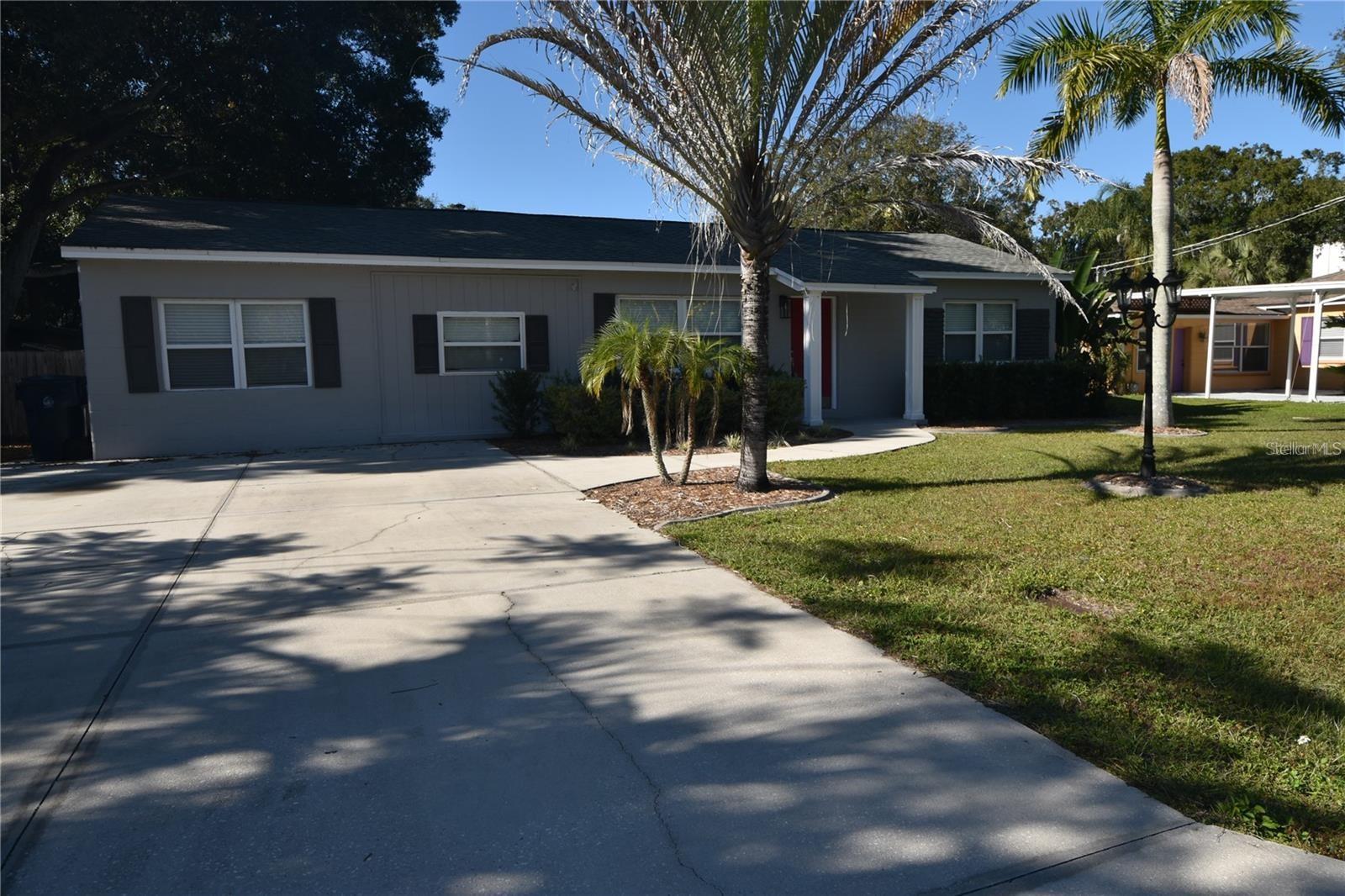 Charming 3-Bedroom Home with Office/Den in the Heart of South Tampa Welcome to this beautifully updated South Tampa residence, ideally situated on nearly a quarter-acre lot just one block from Bayshore Boulevard. This inviting home offers 3 bedrooms, 2 full bathrooms, and a spacious bonus room perfect for use as an office, den, or library—all within 1,404 square feet of thoughtfully designed living space. Step inside through the covered front entry and into a bright, open family room that flows seamlessly into the renovated eat-in kitchen. The kitchen is a true highlight, featuring quartz countertops, crisp white cabinetry, a built-in desk, a glass cooktop, and brand-new stainless steel appliances. A sliding door opens from the kitchen to a large, covered and screened-in lanai that overlooks a generous, fully fenced backyard—complete with a play area, an air-conditioned shed, and an additional storage shed. Throughout the home, you'll find stylish laminate flooring—no carpet—adding to the low-maintenance appeal. The primary suite is warm and welcoming, offering a private en suite bathroom with dual vanities and a stand-alone shower. Two additional bedrooms, a second full bathroom, and a flexible bonus room are located on the opposite side of the home, providing privacy and functionality for families or guests. Lawn care and pest control are included in the monthly rent, offering added convenience and value. The location is unmatched—just minutes from major thoroughfares including the Selmon Expressway, Gandy Boulevard, and South Dale Mabry Highway, with Downtown Tampa only 15 minutes away. MacDill Air Force Base is a quick 4-minute drive, making this an ideal home for military professionals. This South Tampa gem offers comfort, space, and unbeatable convenience—schedule your private showing today!