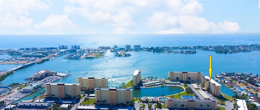 Welcome to your dream home in a luxurious 55+ community, nestled on the serene shores of Boca Ciega Bay. This exquisite two-bedroom, two-bathroom condo offers resort-style amenities combined with the tranquility of waterfront life.

As you step into the bright and airy kitchen, you'll be greeted by the sun's natural light reflecting off the updated countertops. The kitchen flows seamlessly into the dining and living room areas, featuring beautiful luxury vinyl flooring—perfect for both elegance and ease of maintenance. This open space is ideal for relaxing and entertaining, boasting spacious interiors with breathtaking views of the glistening waters.

The guest bedroom isn't just a place to stay; it's a retreat, featuring an en-suite bathroom that's been newly remodeled to ensure your guests' comfort and privacy. The master suite is a haven of peace, with a private bath with a double entrance. Your bonus Florida room is perfect for relaxing and enjoy the immersive experience of the water vistas. It's not just a room—it's a panorama, elevating every moment of your rest.

For added convenience, the unit includes a utility closet, with communal laundry facilities located on every floor. The gated community spans over  40 lush acres and is vigilant with 24-hour security, ensuring peace of mind alongside luxury.

Step outside and indulge in the array of amenities. Two heated pools beckon for a leisurely swim, while the clubhouse will soon  be  ready for your next social event and will also feature a full-size gym, billiards room, and an activities area offer endless entertainment and interaction within the community. With a marina currently under development, soon you'll have the opportunity to dock your boat just steps from your door.

Outdoor living is just as lavish, a grill and sitting area located behind the Columbia building ideal for gatherings .Engage in a bit of fishing at the pier on the lagoon, a serene spot for catching both fish and stunning sunsets.
This is not just a condo; it's a lifestyle choice for those who seek serenity and social vibrancy in equal measure. Don’t miss the opportunity to make this waterfront gem your new home. And it's furnished so bring your flip flops and a fishing pole and start enjoying the life style you so generiously deserve.
Discover the blend of comfort, convenience, and luxury living—all within a vibrant and welcoming community. Contact us today to schedule your personal tour. PRICED TOO SALE!