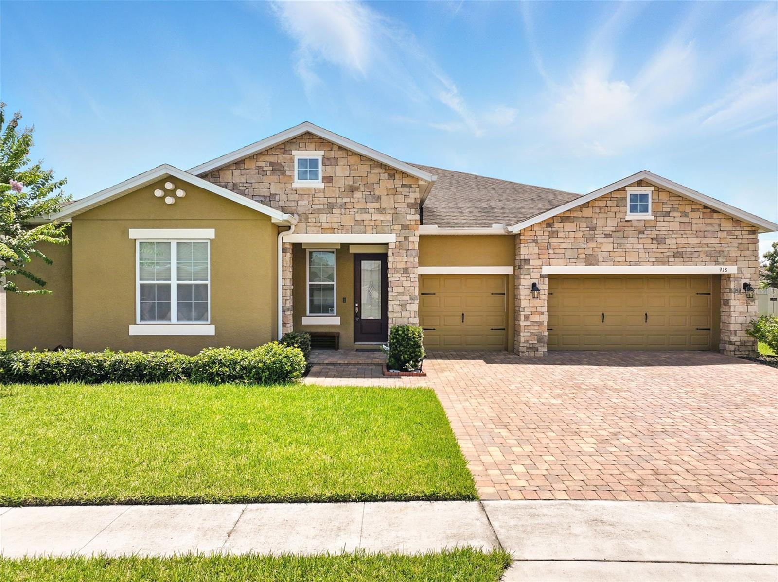 WELCOME TO YOUR DREAM HOME! $10,000 SELLER CREDIT. Experience the perfect blend of elegance, space, and thoughtful upgrades in one of the most sought-after areas along the Ocoee/Apopka border. This beautifully designed 4-BEDROOM, 3.5-BATHROOM Allegra model by Surrey Homes offers a rare combination of MULTI-GENERATIONAL FLEXIBILITY, MODERN FUNCTIONALITY, and RESORT-STYLE outdoor living all set on an OVERSIZED LOT in a peaceful, established neighborhood. From the moment you arrive, the STONE-ACCENTED EXTERIOR, RAIN GUTTERS, manicured landscaping, and extended paver driveway create a striking first impression. The split 3-car garage offers excellent flexibility for parking, storage, or hobbies. Inside, enjoy a bright, OPEN LAYOUT with 12-FOOT CEILINGS, TILL FLOORING and CROWN MOLDING THROUGHOUT, offering a perfect blend of luxury and comfort. The formal dining room and expansive family room flow seamlessly into a gourmet kitchen featuring 42” cabinetry, granite countertops, a large center island, oversized walk-in pantry, and breakfast nook overlooking the backyard. A private study room near the front entry is ideal for working from home, reading, or quiet retreat. The home includes two spacious primary suites, both with spa-style baths featuring soaking tubs, walk-in showers, and large walk-in closets—ideal for multi-generational living. The fourth bedroom and third full bath are tucked in a private wing, perfect as an in-law or guest suite. A standout feature is the impact-resistant triple sliding glass door, leading to an oversized covered lanai (20’ x 17’8”) that opens to a beautifully landscaped backyard with custom pavers felling your own resort-style outdoor escape and a perfect for entertaining or relaxing. An additional highlights include an upgraded luxury powder room off the hallway to the Lanai access. This community has NO CDD, LOW HOA and zoned in great hospital and school district. Conveniently located just 10 minutes from vibrant Downtown Winter Garden, 30 minutes to Downtown Orlando, and close to all major highways (529, 408), Disney parks, shopping, dining, and more. This is a rare opportunity to own a move-in ready, well-designed single-story home in one of Central Florida’s most sought-after areas. Come see it in person—your forever home awaits at 918 Blackthorn Dr. Schedule your private showing today! USE VIRTUAL VIDEO TOUR for additional potential description.