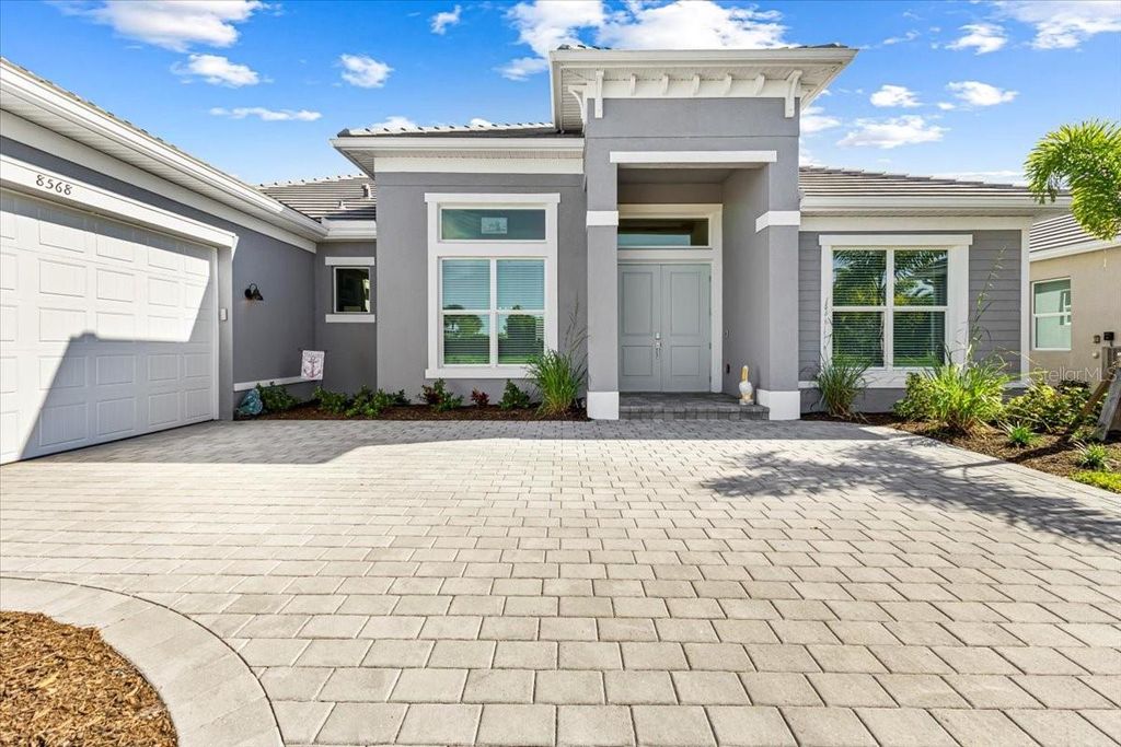 Photo of 8568 Shore Lake Drive, Englewood, FL 34224 (MLS # D6145343)