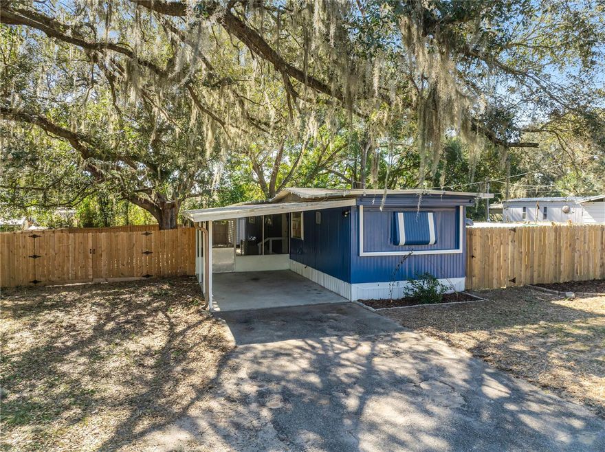 Affordable Florida living awaits! This 2-bed, 2-bath mobile home on .22 acre with owned land offers a rare opportunity to own your property without lot fees in the Summerfield/Orange Blossom Hills area. Enjoy a recently updated bathroom, a fully fenced backyard perfect for pets and privacy, plus a greenhouse for gardening enthusiasts. Located on SE Hwy 42 just minutes from The Villages’ shopping, dining, and recreation, this home is ideal as a primary residence or investment under $100K. Financing may be available for qualified buyers. Bring your ideas and make it your own!