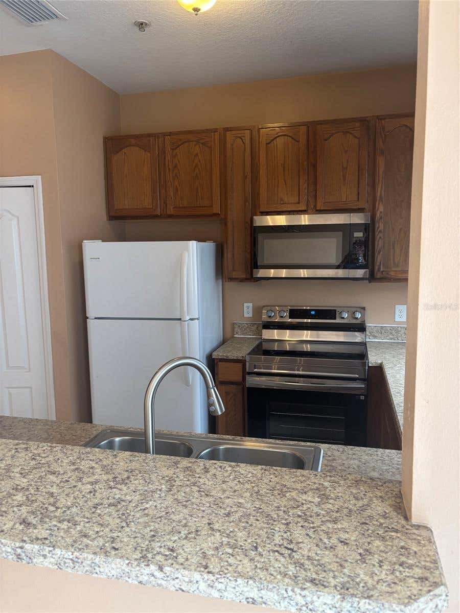 Photo of 7415 Lago De Oro #B-4, Orlando, FL 32822 (MLS # O6412989)
