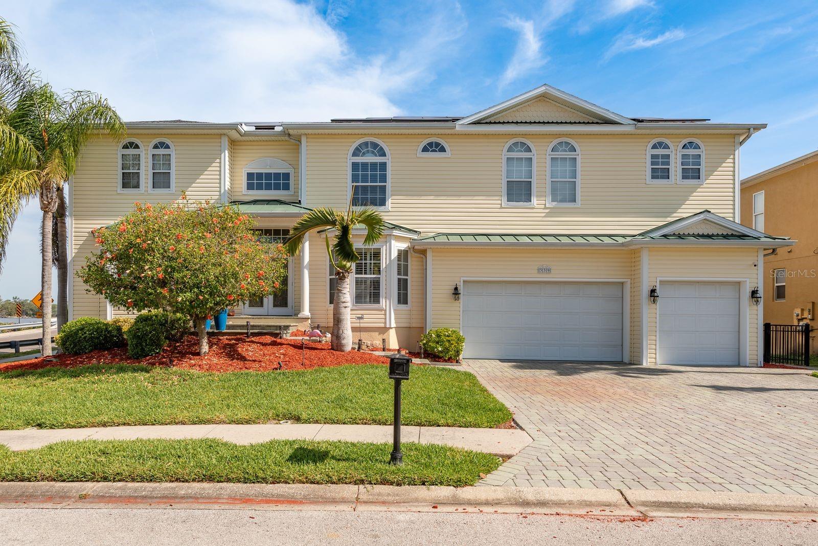 Welcome to your dream waterfront home nestled in beautiful Tarpon Springs. This coastal-inspired residence offers 3,154 square feet of thoughtfully designed living space with 4 bedrooms, 4 bathrooms, and a versatile study that could serve as a 5th bedroom.
Enjoy breathtaking cross waterfront views of the Bayou and saltwater canal from nearly every room. The light-filled interior features plantation shutters, creating a bright, airy atmosphere with undeniable coastal charm.
The gourmet kitchen is a chef's delight with rich wood cabinets, gleaming granite counters, and stainless steel appliances. A convenient serving/coffee bar adds functionality and elegance to the space.
Plus an inviting living room with gas fireplace, spacious dining room, foyer, interior laundry room plus pool bathroom.
Retreat to the elegant primary bedroom featuring its own gas fireplace and luxurious private bathroom with garden tub, separate shower, and dual vanities. A second bedroom with private bath provides perfect accommodations for guests or family members desiring their own sanctuary. Additional bedrooms are generous in size.
Outdoor living reaches new heights with a screen-enclosed pool and spa, plus a spacious screen enclosed lanai featuring a complete outdoor kitchen—ideal for entertaining while enjoying spectacular water views.
All you need is your boat to enjoy the oversized dock which includes water and electric hookups, a 10,000 lbs. boat lift, and a new concrete seawall cap. Offering a short ride to the Gulf waters.
Recent upgrades include solar panels (2021) and a new roof (2021), combining style with energy efficiency. The second-floor screen-enclosed lanai with built-in gas fireplace offers another stunning vantage point for enjoying those tranquil water views.
Outdoor activities are unlimited as there is something for everyone, whether you enjoy wandering through the quaint fishing village of nearby Tarpon Springs "The Sponge Docks" or savoring eclectic eateries, browsing charming shops, strolling the beaches of Fred Howard Park /Sunset Beach or venturing out on the water for fishing or a sunset cruise. Tarpon Springs is within easy proximity to Tampa International Airport and is located within the Tampa Bay area!
Do not miss viewing the home!