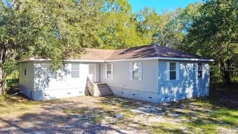 Come see this beautiful home located off Hwy 60 in Lake Wales. The house and property has over 2 acres of land plenty of peace and quite. House is visable from St Rd 60 but a slight view if you dont know its there you will not see it. House offers 4 bedrooms and 2 bathrooms. Luxury vinyl plank flooring throughout the house. Kitchen is the main focal point shaker style cabinets with granite countertops and farmhouse sink. This house also have a office or a bonus room or for storage. Home Was built in 2020. Located on a corner with a private driveway to access the property.