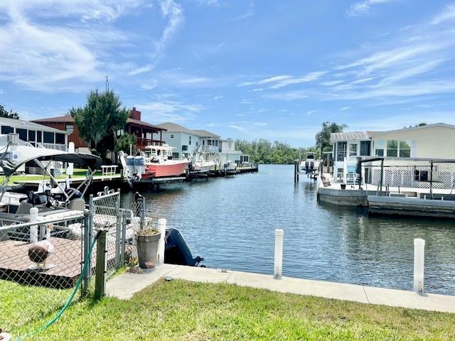 HOMOSASSA WATERFRONT !!! Direct River View From This Amazing Canal Front Block Home. NO FLOOD DAMAGE !!! HUGE 80 FOOT SEAWALL FOR LARGE BOATS !!! Currently Being Used as a Vacation Rental This 4 bedroom, 2 and a Half Bathroom Home Can Be Used as a Short Term, Long Term, or Full Time Residence. This Property Comes Turn Key and Fully Furnished W/ Coastal Themed Decor. Kitchen W/ Hickory Cabinets, Breakfast Bar and Stainless Appliances. Living Room W/ 65 Inch Smart TV. Dining Room W/ 3 Sets of Glass Sliders That Provide Great River Views. King Bedroom W/ 55 Inch Smart TV, 2 Queen Water View Bedrooms W/ 55 Inch Smart TV's, "Bunk Room" Bedroom W/ 4 Twin Beds and a Built in Desk Area W/ 65 Inch Smart TV. Laundry Room W/ Pantry and Utility Sink. Screened in Patio/Game Area W/ 65 Inch Smart TV. The Outside Storage Building Has Room For Your Kayaks and Paddle Boards. Golf Cart Sized Attached Garage is Currently Being Used For Storage and Supplies. The Huge Yard is Fully Fenced W/ Extra Space For Parking, Boats and Trailers. Located Walking Distance to Seagrass Resort and Margarita Grill, Minutes to the Famous Monkey Island, Mcraes, The Old Mill, Crumps and Other Popular Homosassa Fun Spots.