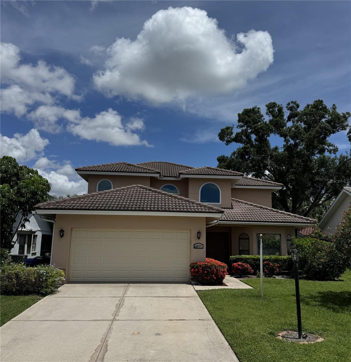 Located in Sarasota's highly desired Longwood Run community, this spacious 4-bedroom, 2.5-bath home offers a bright, airy interior and a functional two-story layout perfect for family living and entertaining. Enjoy easy-to-maintain laminate vinyl and tile flooring throughout – no carpet here! The home features two distinct living rooms: a private, enclosed space for quiet relaxation, perfect for a formal dining room, and an open-concept area that seamlessly connects to the kitchen and dining. Sunlight floods both spaces, with sliding glass doors opening to a backyard oasis. This outdoor haven boasts a sparkling, screened-in swimming pool, an expansive covered lanai with a grilling area, and ample space for lounging or outdoor dining, effortlessly blending indoor comfort with outdoor enjoyment. The heart of the home is a spacious kitchen with warm wooden cabinetry, elegant granite countertops, a center island breakfast bar, and an modern dark-finished appliance package. The dining area, seamlessly connected to the kitchen, is illuminated by stylish pendant lighting and benefits from abundant natural light, enhancing the bright and airy feel of the entire space. The main level includes a convenient first-floor bedroom, a half bath, and a laundry room, ideal for guests or a home office. Upstairs, the spacious primary suite offers a walk-in closet and an en-suite with a double vanity and large glass shower. The two other upstairs bedrooms feature ample closet space, ceiling fans, and large windows, sharing a full bathroom with a granite-topped vanity, tiled floor, and a shower/tub combo. This home also includes a two-car garage, providing ample parking and storage. The highly sought-after Sarasota location truly sets this home apart. Enjoy an exceptional Sarasota lifestyle just minutes from the world-class shopping and dining destination of UTC, offering an endless array of stores and restaurants. Its prime location also provides quick access to Sarasota-Bradenton International Airport (SRQ), recreational opportunities at Nathan Benderson Park, and I-75 for convenient travel to Sarasota's stunning Gulf beaches and beyond. NOTE: This community is governed by a homeowners association. Approval may include an application, background screening, fees, and an approval process. Contact the agent for details.
