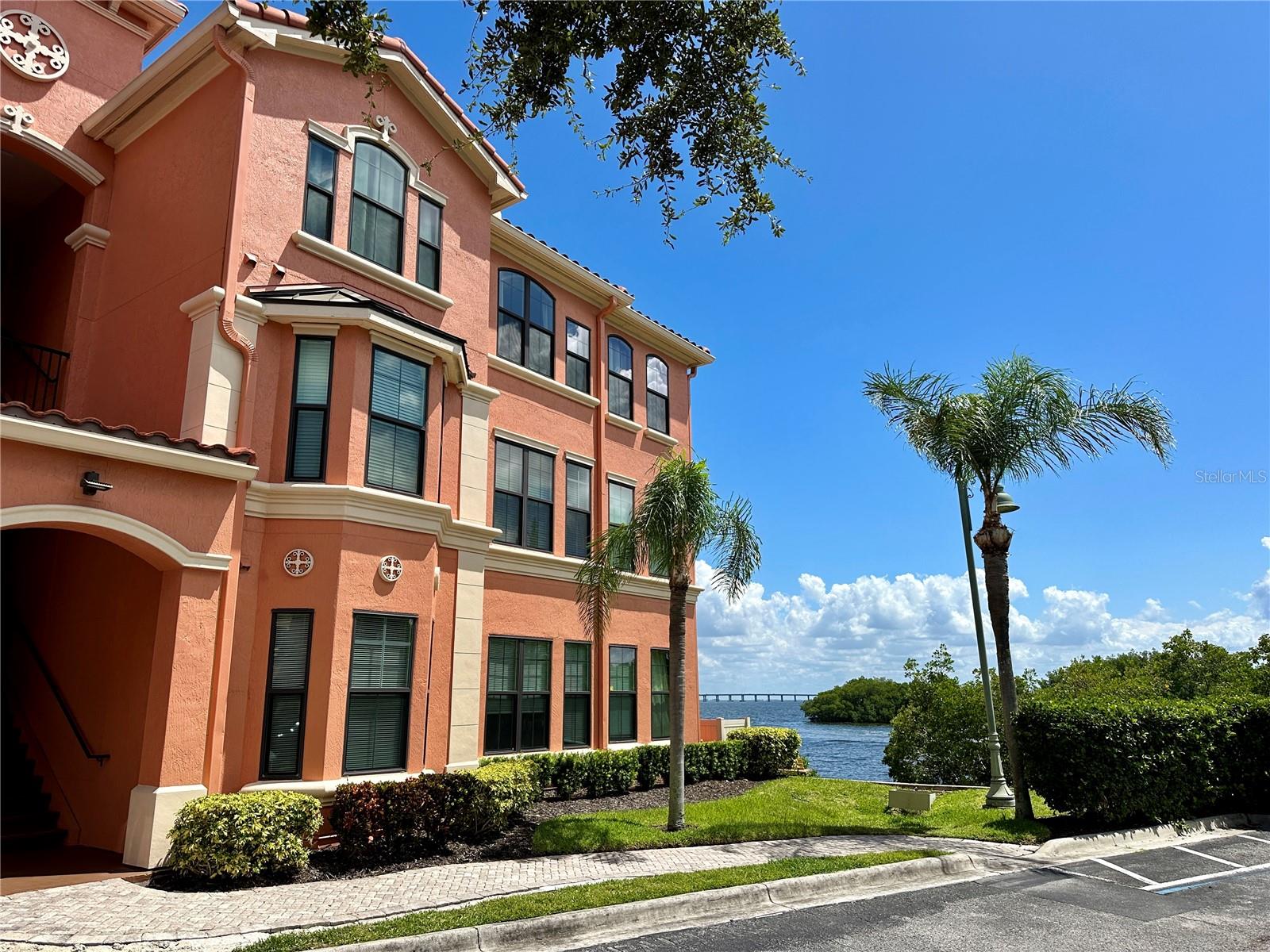 Waterfront living at its finest. Enjoy the fabulous water views in this lovely 2 bedroom, 2 bathrooms Fully Furnished condo. An open floor plan provides a living/room dining room area that separates the bedrooms, a utility room with a full-size washer and dryer, kitchen with granite countertops and each bedroom featuring its own walk-in closet. This luxurious resort-style community features: a 24 hour guard gate, a heated pool, sauna and hot tub, 24/7 fitness center, 24/7 business center with internet access, a car care center, playground, beach volleyball court, a 1.5 mile lighted paved walkway along the shore of Old Tampa Bay and access to a dock on the Grand Bellagio side of the complex. This unit provides easy access to the award-winning Gulf Beaches, Tampa International Airport, dining, shopping and area attractions and is a must-have for those wanting the Florida lifestyle.