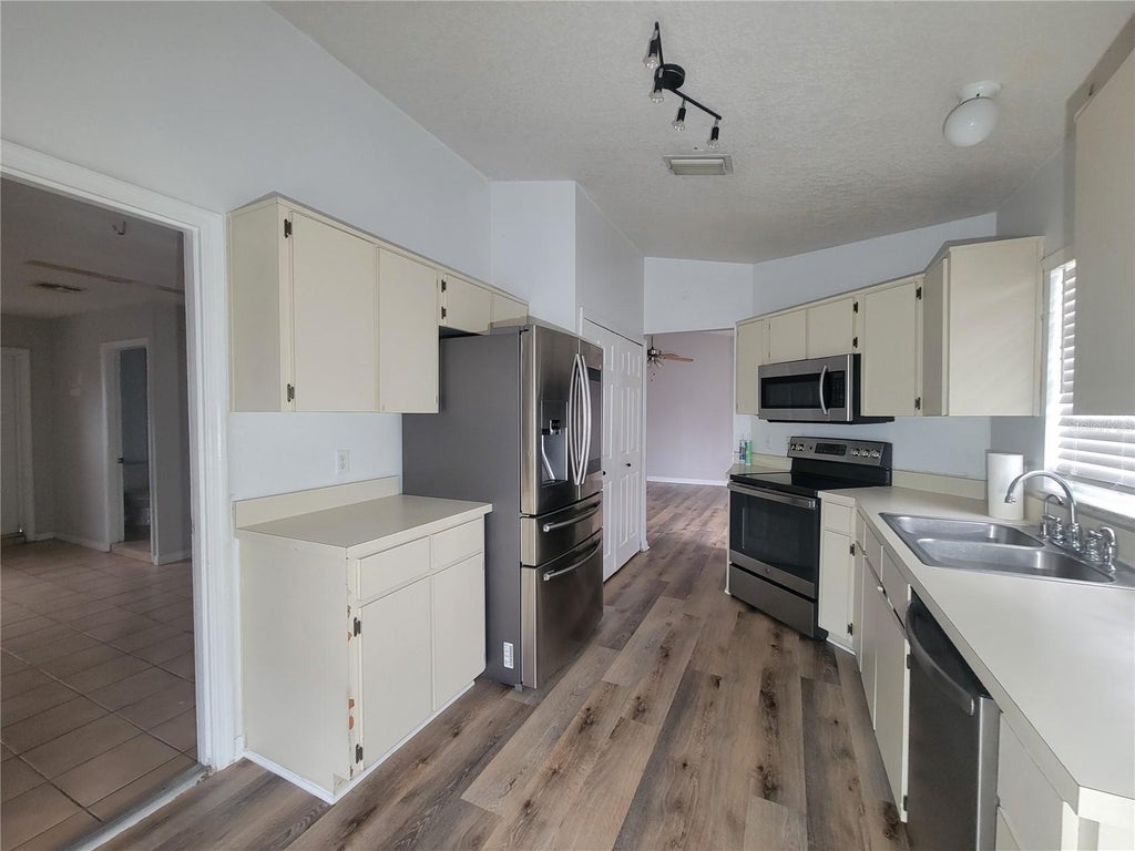 Photo of 9827 Dean Cove Lane, Orlando, FL 32825 (MLS # O6445687)