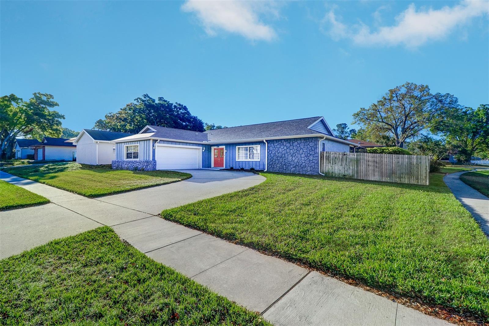 !!!!!Outstanding Palm Harbor home that features 3 bedrooms, 2 full baths, 2 car garage and POOL! Light and bright and located in the much-desired Palm Harbor area that is zoned for some of the best schools in Pinellas County including Palm Harbor University. This beautiful home that is located on a HIGH and DRY corner fenced in lot, no flood insurance. A great floorplan with a large family room, formal living room and dining room area. Sliding glass doors from the dining room and the family room you will be able to open your home up to the pool area. GREAT home for entertaining with access to the pool from the family room and pass through windows from the kitchen. Updated kitchen and features cherry cabinets, quartz countertops, stainless steel appliances with convection oven, built in microwave and designer lighting. Split floorplan for maximum privacy with a large master retreat that features large walk-in closet and has sliders out to your pool area. Ensuite with walk in shower plus tub area and both with designer tile, cherry cabinets, and quartz countertops. On the other side of the home, you will find two additional light and bright bedrooms and full bathroom with a tub/shower combo, cherry cabinets, and quartz countertops. For easy maintenance tile flooring throughout the home with no carpet. Inside utility room with laundry sink. Enjoy the Florida lifestyle, you will love the large pool area that is totally screened covered area. Plenty of room on the side of the home to park a boat, Jet Skis, or an RV. This home features many updated designer touches and neutral colors. Located just mins from beaches, schools, shopping, restaurants, Golf Courses and so much more. Located in a non-flood zone. Please call today for your private showing. New roof 2022, updated electrical 2022, newer AC.!!!!