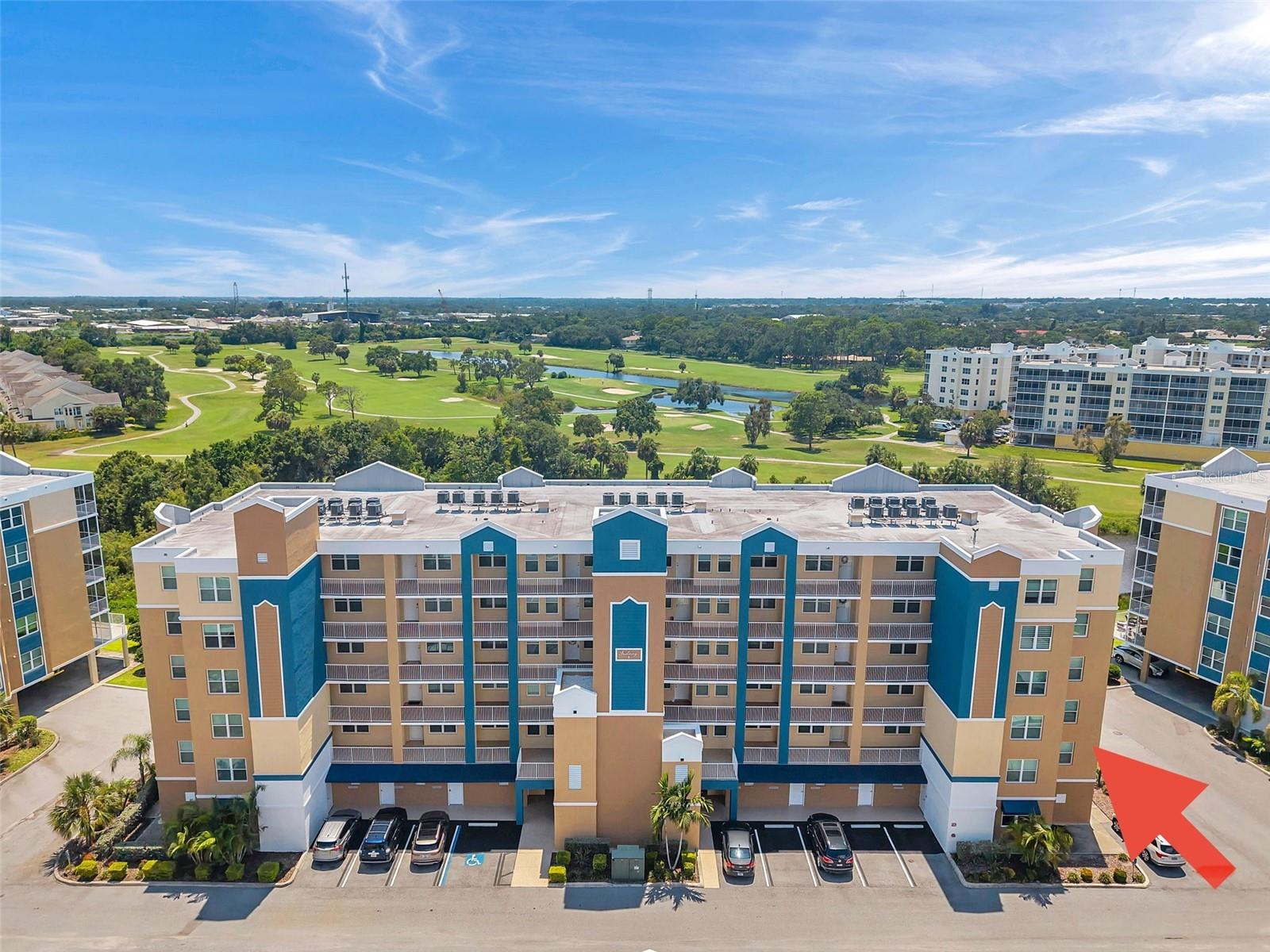 Golf Lake Condos at East Bay are where luxury and everyday convenience meet! Boasting the largest floor plan at 1836 square feet, this end unit offers all-day, natural sunlight and comes FULLY FURNISHED! Enjoy evening sunset skies from your private screened balcony where you'll have views of lush green space, a private pond with fountain ambiance, East Bay Golf Course and abundant wildlife. The open, split floorplan includes: A large Primary Suite with two walk-in closets and an en-suite bathroom; A spacious Living Room with sliding glass doors that lead to the rear screened porch; A Bright Open Kitchen with custom instant hot water tap, quartz countertops, wood cabinets and stainless-steel Whirlpool appliances; An oversized Laundry Room with built-in cabinets and an extra refrigerator. Built in 2020, the combination of concrete block construction and hurricane impact windows make this unit extremely energy efficient. In addition, this unit transfers with a private 1-car garage located under the building and just steps from the elevator! The property offers two pools, a hot tub and a clubhouse. In addition to these amenities, the low monthly fee includes water, trash, sewer, cable/internet, and grounds maintenance. Golf Lake Condos is an exceptional, high quality mid-rise condo that provides tremendous value and high-end standards. This community is highly desirable and sought after. Not only for its premier location and it's increasing values, but also because it's high and dry with no hurricane evacuation necessary. To top it off, you will find the close proximity to shopping, dining, an airport, medical facilities, stadiums, arenas and WORLD CLASS BEACHES simply unbeatable!
