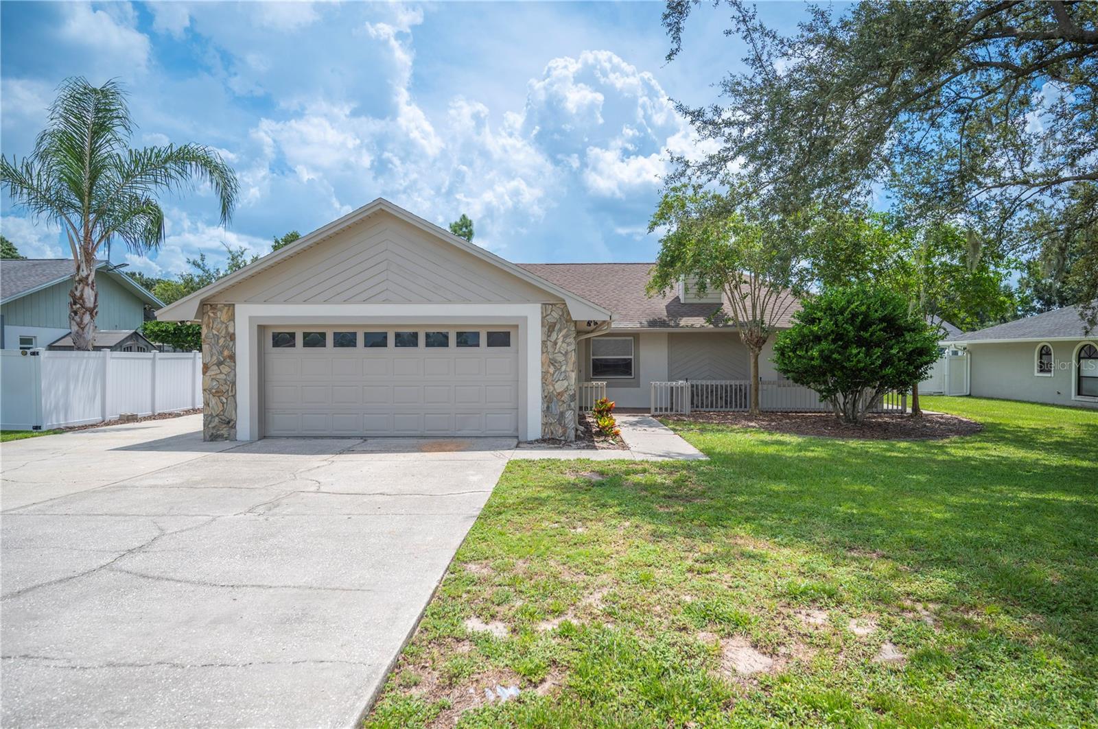 CHARMING Home with Split Floor Plan in Lovely Neighborhood with Different Architectural Designs & Mature Trees! BRIGHT & OPEN with Great Room featuring Wood Burning Fireplace. Lovely Kitchen with Breakfast Bar Open to Dining Room. Laminate Wood Floors throughout makes cleaning so much easier. Crown Molding. Freshly painted inside AND out. Bonus Room/DEN/Florida Room opens to Screened Lanai great for entertaining. Large Fenced BackYard. Cul de sac street - much less traffic passing by! Extra Driveway Space perfect for your boat or trailer, especially with NO HOA! Also, great for many guests. Walkway to the back of the house. Roof 2015. A/C Condenser 2018. Air Handler 2017. Water Heater 2018. GJHS District. You will Love this House!!