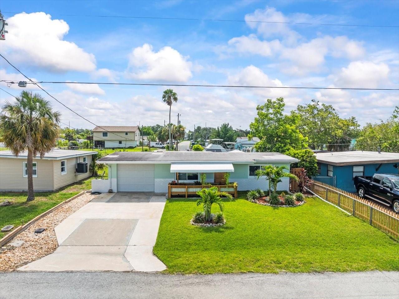 Welcome to 13316 Carol Drive in Hudson, FL — a stunning, fully remodeled waterfront home that perfectly blends comfort, style, and outdoor living. Inside, you'll find brand new flooring throughout, newer windows, and a fresh, contemporary design that makes this home truly move-in ready. The open layout offers a spacious living area, an updated kitchen with sleek finishes, quartz countertops, a stylish kitchen island, brand new appliances, and a beautifully updated bathroom. Enjoy year-round comfort with a brand new AC system.
Step outside to your own private oasis! This property sits directly on the water and features a large backyard, a private boat dock, and a patio perfect for entertaining or relaxing. With direct Gulf access, you'll be just minutes from open water — ideal for boating, fishing, and embracing the ultimate Florida lifestyle. Located close to local dining, shopping, and more — this gem has it all!