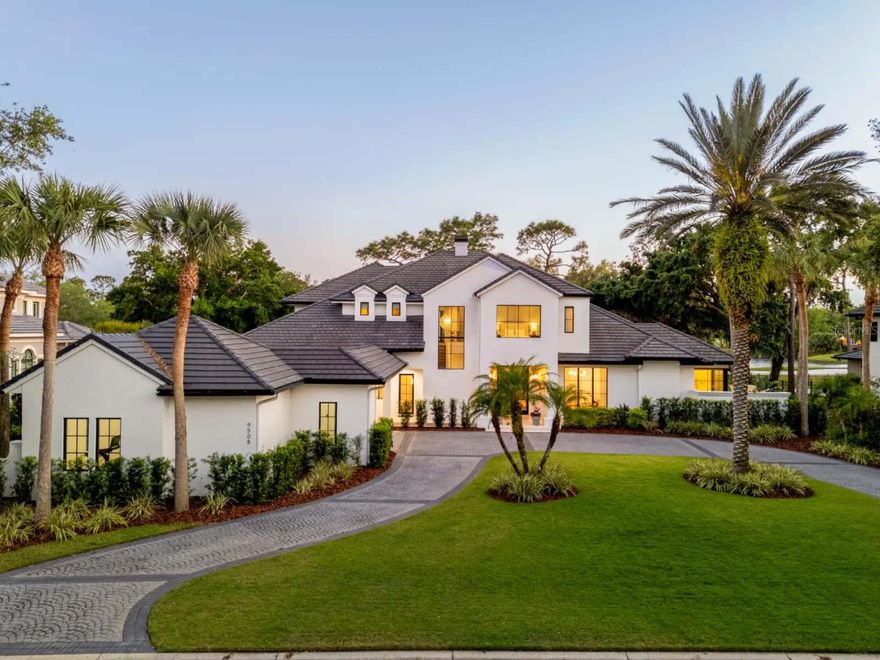 Nestled along the 12th fairway of Lake Nona’s famed championship golf course, stunning panoramic fairway and water views provide the backdrop for this gorgeous estate. The home was expertly reimagined by designer Ashley Martin Homes and remodeled by DeVoe Custom Homes in 2022.  
 
Custom double doors open to the home’s welcoming foyer, which upon entry offers the first views of the home’s prime golf course location through floor-to-ceiling windows. A formal sitting room greets guests and shares a two-sided fire place with the beautiful, private dining room. 
 
Displaying preeminent craftsmanship at every turn, custom archways, European Oak hardwood floors, and beamed ceiling details extend beyond the entry into the heart of the home where an epicurean kitchen boasts two expansive islands, custom cabinetry, a walk-in pantry and state-of-the-art appliances from Wolf, Subzero and Miele. Floor-to-ceiling windows continue into the adjoining family room, which flood the space with natural light while taking full advantage of the serene views. 
 
The owner’s suite is perfectly situated for privacy, at the back of the home on the first floor, and encompasses a morning bar, large custom walk-in closets and a breathtaking bathroom. Custom vanities, a modern soaking tub and glass-enclosed shower are adorned with Brizo Luxe Gold fixtures, Rejuvenation knobs and pulls and handmade Zellige and mosaic tiles, which create a personal sanctuary within the home.
 
The upstairs entertainment loft features a custom wet bar with dual undercounter beverage refrigerators, and offers access to the screen enclosed balcony with elevated, panoramic views. Three en suite bedrooms, including a spacious junior primary suite, complete the second level.
 
The open outdoor living area creates the perfect setting with the covered lanai, summer kitchen and al fresco dining area. Highlights of the new pool include a sun shelf and heated spa.
 
Additional features include:
First Floor Guest Suite | Executive Office | Oversized Laundry and Mudroom | Hidden Washer/Dryer in Primary Closet | Two, 2-Car Garages with Temperature Control