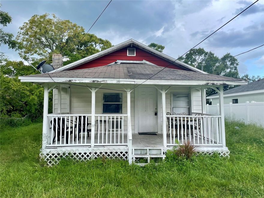 Back On Market Due To Previous Buyer Not Submitting EMD. Welcome to this 2-bedroom home in Auburndale Heights, just off US-92 near shopping & dining. Step onto the expansive 9' x 18' covered, east-facing front porch, the perfect spot to enjoy peaceful mornings and beautiful sunrises. Inside features an open floor plan with wood-look laminate flooring and walls in need of your personal touch. The spacious layout provides a seamless flow from the large living room into the kitchen, with the dining area nestled between—perfect for comfortable living and easy entertaining. Toward the back of the home, the bathroom features a single sink vanity and a tiled shower/tub combo. Just across the hall is the first bedroom, followed by a convenient laundry room, and finally the primary bedroom at the back, which offers access to the sizable backyard. With its great location, functional floor plan, and opportunity to add your personal touch, this home is full of potential! Bring your vision, add some TLC and make it your own!