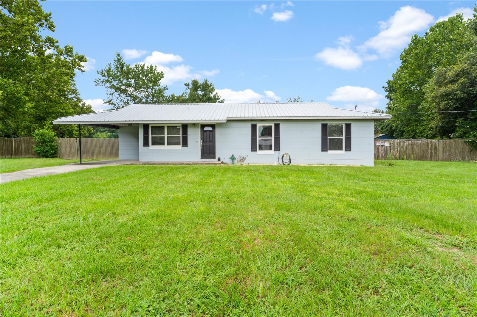 CHARMING COUNTRY HOME ON 1 ACRE IN WILLISTON!
Don’t miss this delightful 3 bedroom, 2 bath concrete block home perfectly placed on a generous 1-acre lot with paved road frontage in a peaceful rural setting—just minutes from downtown Williston!
Step inside to discover a thoughtfully remodeled kitchen designed for easy entertaining, roomy cabinet pantry for storage, new luxury vinyl plank flooring in the main living areas, and a brand-new A/C system with updated ducts and vents. Other recent upgrades include a new water heater, new metal roof, and a septic system with new drain field for long-term peace of mind.
Enjoy the outdoors on the concrete patio overlooking a spacious, fenced backyard that backs up to a scenic cattle farm—perfect for gatherings, gardening, or adding a workshop or shed.
This move-in-ready home offers the best of quiet country living with modern updates and unbeatable value. Schedule your tour today—this gem won’t last long!