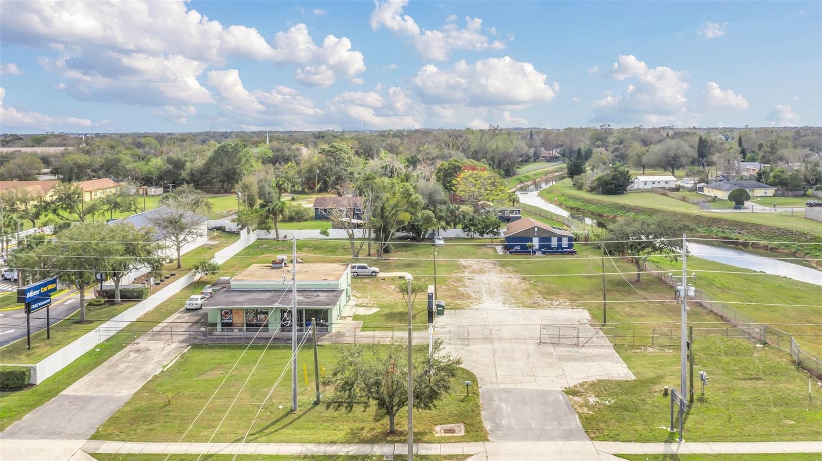Prime Commercial Property on High-Traffic East Colonial Drive Exceptional opportunity to own 1.24 acres with 230 feet of frontage on East Colonial Drive (Hwy 50), This high-visibility location is less than ½ mile from SR 417 and provides direct access to SR 528, I-4, and major highways. The property is zoned C-3, offering unlimited possibilities including car dealerships, light manufacturing, and retail. It features a free-standing building and a single-family home that could also be rented. Additionally, there is vacant land for potential expansion or additional uses. With a traffic count exceeding 50,000 vehicles per day, this is a SUPER BUY for investors looking for multiple income streams. Don’t miss out—call today to schedule a showing!