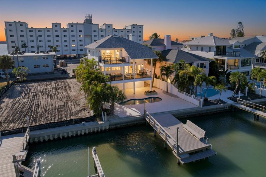 Perfectly situated where Blind Pass opens into a quiet cove, this FEMA-compliant waterfront home offers both peace of mind and the perfect setup for boating enthusiasts. The location is known locally as one of the safest places to keep a boat — calm, deep water with easy, bridge-free access to the Gulf of Mexico just minutes away. And when you’re ready for sand and sunsets, the freshly renourished beaches are right across the street.

The home itself is fully functional and move-in ready, offering a solid foundation for your own design ideas. The main living areas open to sweeping water views, while the outdoor space invites you to imagine rebuilding a shaded bar or lounge area under the home’s elevated structure — an ideal setting for relaxing by the pool and watching the boats glide by.

Inside, the kitchen is clean and practical, awaiting a modern touch from its next owner. Both HVAC condensers were replaced in 2025, and the spacious garage provides ample room for vehicles, storage, and all your coastal gear.

Located in Treasure Island’s beloved Sunset Beach community — with restaurants, open-air bars, and boutique shops just a stroll away — this home combines exceptional boating convenience, low-cost FEMA-compliant insurance eligibility, and the relaxed beach lifestyle that makes this corner of the Gulf Coast so special.