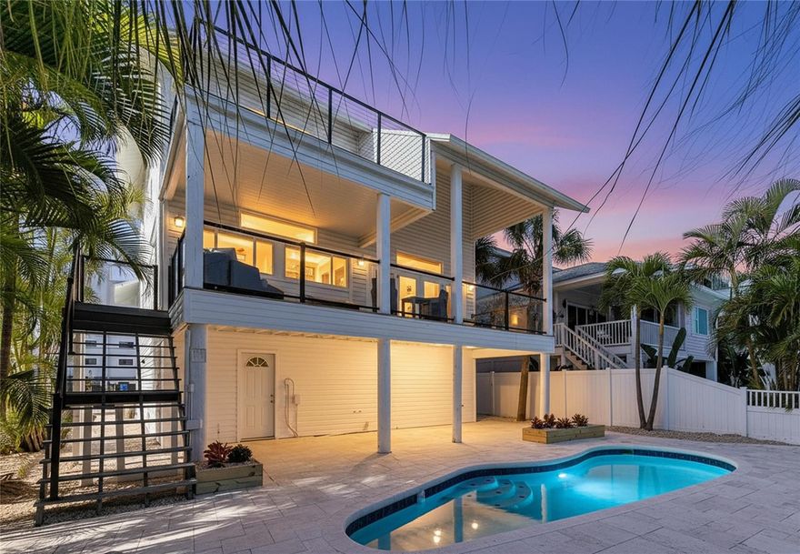 Perfectly situated where Blind Pass opens into a quiet cove, this FEMA-compliant waterfront home offers both peace of mind and the perfect setup for boating enthusiasts. The location is known locally as one of the safest places to keep a boat — calm, deep water with easy, bridge-free access to the Gulf of Mexico just minutes away. And when you’re ready for sand and sunsets, the freshly renourished beaches are right across the street.

The home itself is fully functional and move-in ready, offering a solid foundation for your own design ideas. The main living areas open to sweeping water views, while the outdoor space invites you to imagine rebuilding a shaded bar or lounge area under the home’s elevated structure — an ideal setting for relaxing by the pool and watching the boats glide by.

Inside, the kitchen is clean and practical, awaiting a modern touch from its next owner. Both HVAC condensers were replaced in 2025, and the spacious garage provides ample room for vehicles, storage, and all your coastal gear.

Located in Treasure Island’s beloved Sunset Beach community — with restaurants, open-air bars, and boutique shops just a stroll away — this home combines exceptional boating convenience, low-cost FEMA-compliant insurance eligibility, and the relaxed beach lifestyle that makes this corner of the Gulf Coast so special.