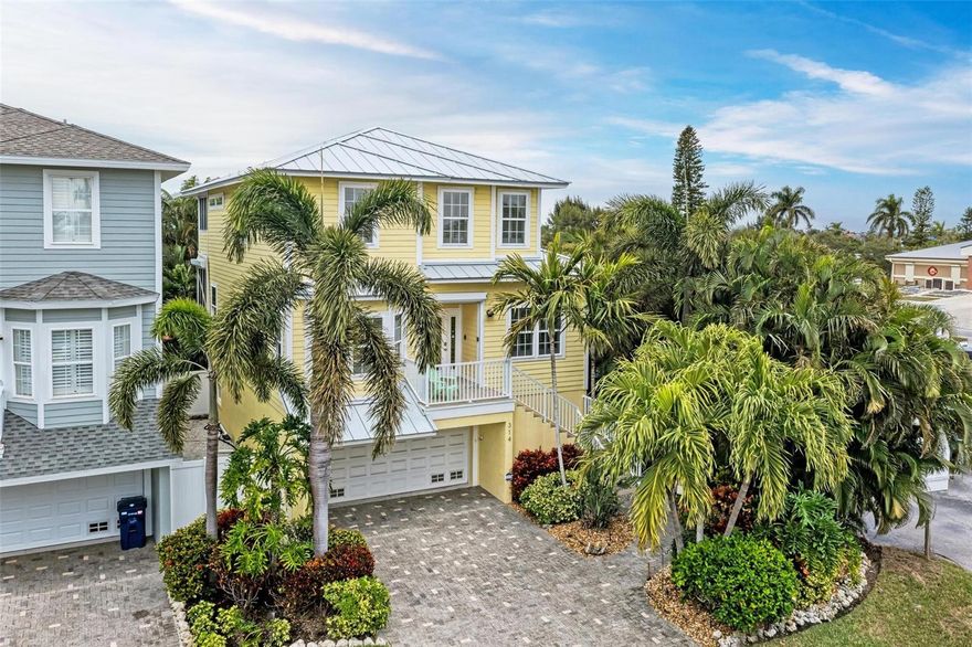 Welcome to 314 60th St in Holmes Beach! This inviting residence offers the perfect blend of comfort and convenience in the heart of Anna Maria Island. This well-appointed home features 4 bedrooms and 3 bathrooms, separate dining room, plus a bonus room and bar leading to the pool area, providing ample space for both relaxation and entertainment.  There are 2 screened lanais plus a sunroom. The roof is metal and installed in 2019 and the home has Hurricane impact windows.  The interior is tastefully designed creating a welcoming atmosphere for residents and guests alike. The oversized garage has extended space and room for a golf cart and 2 vehicles. One of the standout features of this property is its proximity to a host of amenities. Just a short stroll away, you'll discover the pristine beaches of the Gulf of Mexico, allowing for endless days of sun, sand, and surf. Whether you're a fan of water sports, pickleball, sunbathing, or beachcombing, the options are at your fingertips. The area boasts an array of charming cafes and restaurants, offering everything from fresh seafood to international cuisine. Indulge your taste buds with the local flavors and savor the island's culinary scene just moments from your doorstep. Additionally, this property is conveniently situated near parks, shops, and recreational areas, ensuring there's always something to do. Explore the local boutiques, take a bike ride through the scenic neighborhoods, or simply relax in the nearby green spaces. Back at home, the property offers an a heated pool and a hot tub in the private backyard, making it a true sanctuary for comfortable living. Whether you're seeking a permanent residence or a vacation retreat, 314 60th St presents a unique opportunity to embrace the laid-back island lifestyle. Rentals are allowed with 7 day minimums.  Don't miss out on the chance to call this charming property home. Schedule a viewing today.