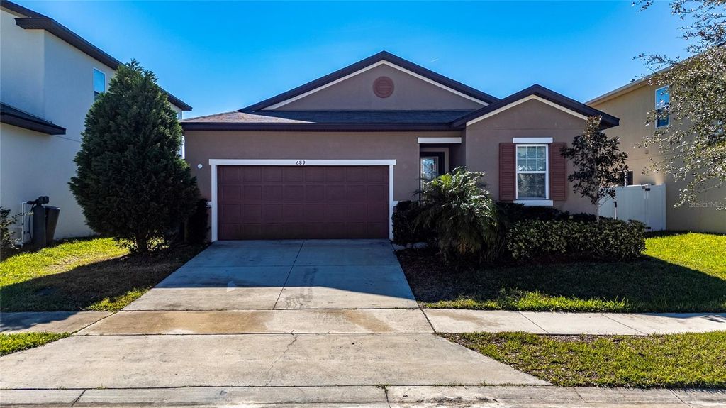 Photo of 689 Meadow Pointe Dr, Haines City, FL 33844 (MLS # S5142037)