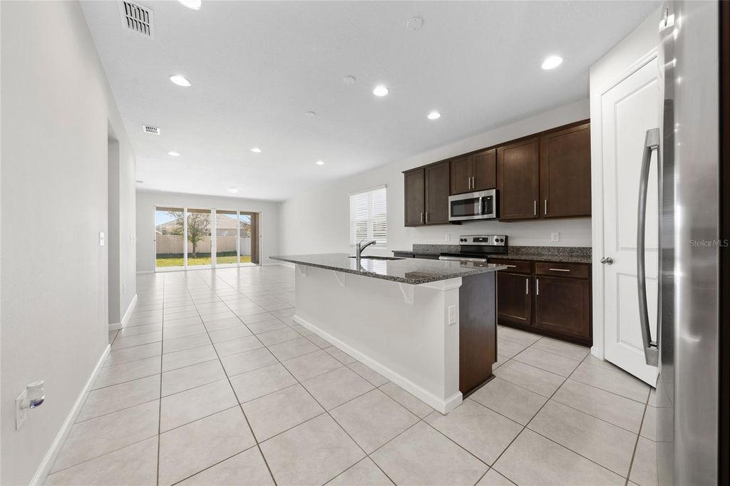 Photo of 689 Meadow Pointe Dr, Haines City, FL 33844 (MLS # S5142037)