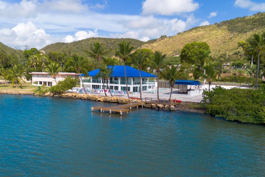 Imposing waterfront estate overlooking the beautiful Bay of Guánica, completely new,
equipped and designed for high-capacity lodging operations, also ideal for buyers
seeking an exclusive summer residence or a private vacation retreat. The property
underwent a comprehensive transformation of its layout, systems, and functional areas,
resulting in a solid, fully functional space oriented toward tourism, STR operations, and
large-group experiences. Everything is included—turn the key and continue operations
from day one.

Approximately 6,000 sq ft across two levels with capacity for up to 40 guests.

Main level: 4 bedrooms, 2 modern bathrooms, fully equipped modern kitchen, dining
area, family room, open mezzanine with 10 beds, and modern billiard table (approx. 20-
guest capacity).

Seaside sub-level: 4 connected studio units, fully equipped modern kitchen, 4 modern
bathrooms, fully equipped game room, approx. 20-guest capacity.

Outdoor amenities include: oceanfront pool and jacuzzi, private dock, jet ski access,
boat and kayak facilities, gazebo with full outdoor kitchen, EV charger, 60k generator,
1,000-gallon cistern, and spacious outdoor areas ideal for activities.

Designed for STR (HY), large groups, and experiential tourism. 

Qualifies for Tourism Incentive / Act 60, with all permits up to date.