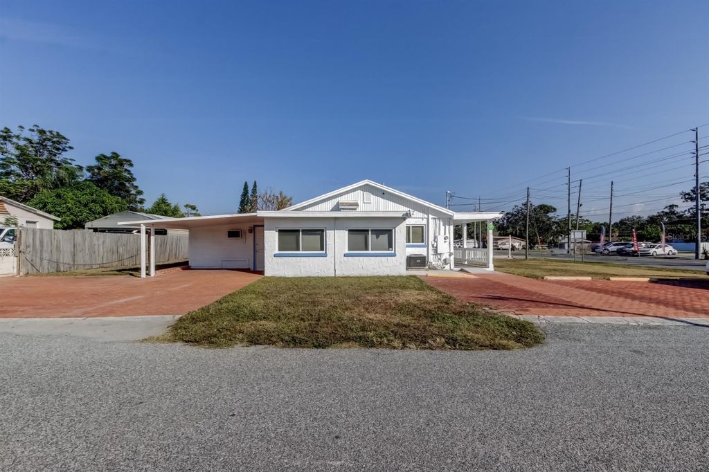 Photo of 4539 Mile Stretch Drive, Holiday, FL 34690 (MLS # TB8450043)