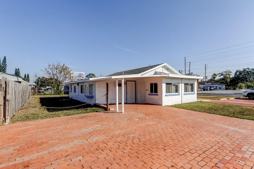 Photo of 4539 Mile Stretch Drive, Holiday, FL 34690 (MLS # TB8450043)