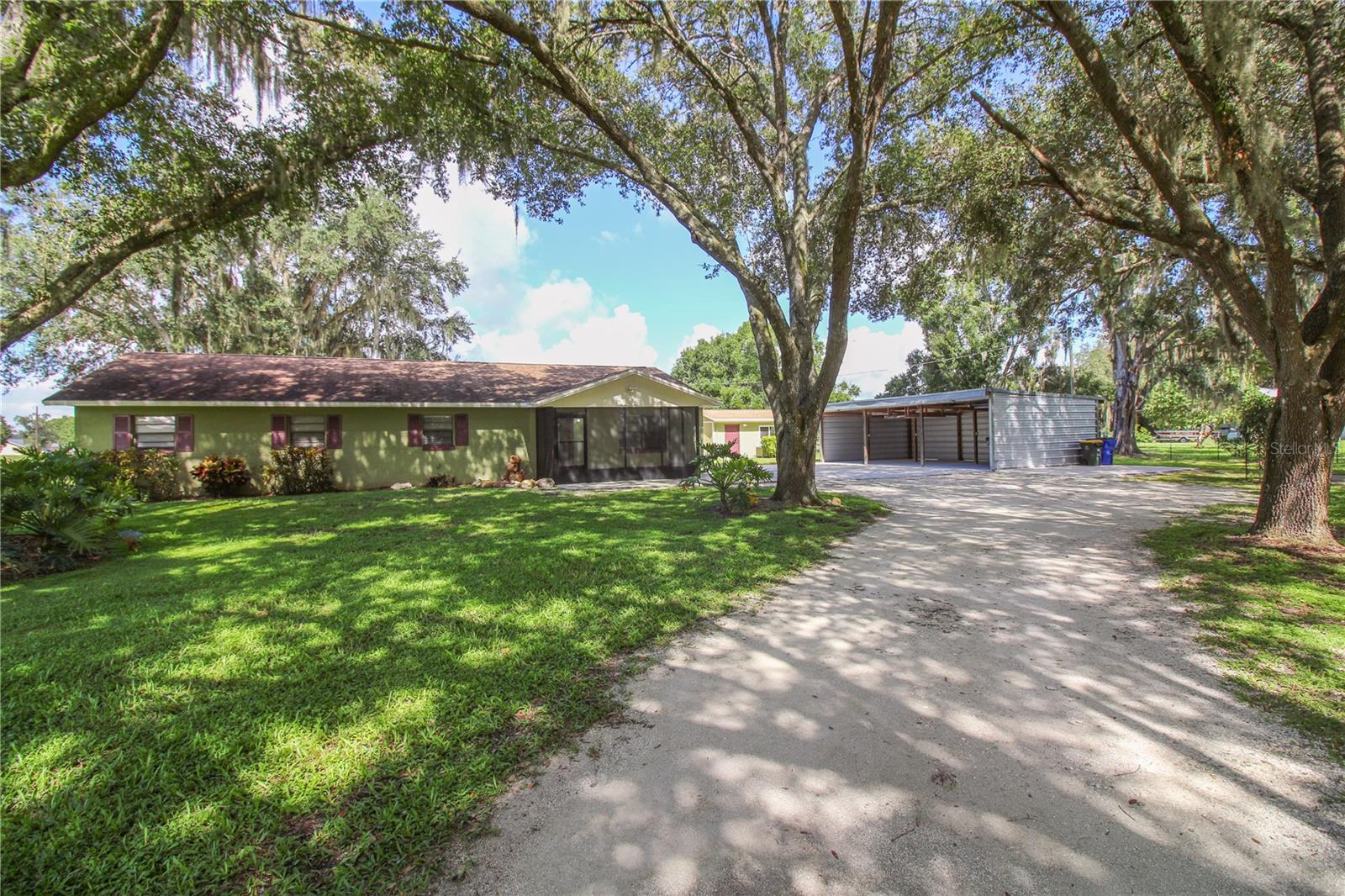 Charming Family Home with Guest House, Pole Barn & 1 Acre of Land. Welcome home to this inviting 4-bedroom, 2.5-bath home nestled on a full acre, complete with a brand-new 1-bedroom, 1-bath guest house/in-law suite. Thoughtfully updated and move-in ready, this property is designed for comfort, gatherings, and making memories.
What makes this home special is room for everyone (and everything!) with a spacious three-bay pole barn, plus a separate parking slab for your RV, boat, or trailer. Shady mature oak trees surround the home, with wide open fields and peaceful pond view to the rear. Freshly painted inside and out, with easy-care flooring: luxury vinyl in the bedrooms and ceramic tile in the main living spaces.
Inside you’ll find a welcoming primary suite with double vanities, walk-in shower, relaxing garden tub, and a custom (13’x7’) California Closet. The upgraded kitchen with solid wood cabinets, stainless steel appliances, granite countertops, and a double oven is perfect for family meals and holiday baking. The handy laundry room and pantry space (8’x8’) has extra storage and space for a second fridge or standing freezer.
The flexible 4th bedroom/bonus room has closing barn doors and can serve as a formal dining room, playroom, or home office. Ceiling fans in every room to keep the whole home breezy and cool.
There is a front screened patio plus a large screened back patio with its own half-bath, overlooking the shaded back yard and fields beyond ideal for BBQs, birthday parties, or just watching the sunset. The (12’x36’) covered porch is perfect for outdoor seating and extra outdoor storage. The unfinished (13’x10’) workshop, with electric installed, provides a blank canvas ready for a custom shop build out.
Additional updates include a new septic drain field, new water heaters, newer roof and a new mini-split A/C in the guest house for year-round comfort.
With NO HOA and NO deed restrictions you can bring your toys, boats, trailers, tractors, RV, AVTs and more. The property is fenced on 3 sides, with space for a large garden or a horse.
Whether you’re hosting family in the private guest suite, storing your boat or RV for weekend adventures, or simply enjoying the shade of the oaks with a glass of lemonade, this home has space for it all.
Come see why this home isn’t just a house—it’s the place where your next chapter begins.