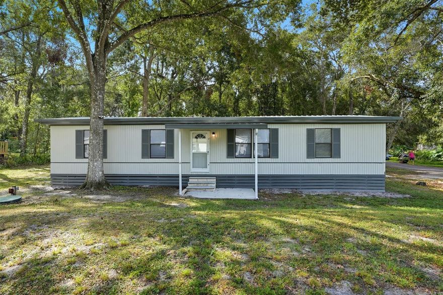 MOVE-IN READY!! COMPLETELY REMODELED with a farmhouse-style design!! Double-wide manufactured home with 3 Bedrooms + 2 Bathrooms + 1 Carport + covered screened Lanai + fenced yard for pets and family + nestled on a corner lot with almost 1/3 of an acre + NO HOA + NO LOT RENT (you own the land) + NO FLOOD!!  Brand NEW AC!

This is a beautiful home that has been all remodeled - gorgeous finishes with accent wall in the living room, too! All NEW stainless steel appliances! New real wood white, shaker kitchen cabinets with breakfast bar for extra seating!! The kitchen is open to the dining room, large family room making this home feel light, bright, and spacious -- great for entertaining family and friends!! You have an extra room to use as a dining room or office/den!! Split floorplan offers privacy to the master suite! Master has ensuite bathroom and large walk-in closet! Bedrooms 2 and 3 also have walk-in closets!! Inside laundry room! Large storage area in the screened porch area for all your tools and storage needs! 

New luxury vinyl flooring throughout the home!! Two full updated bathrooms, too!! This is a GREAT permanent home or seasonal home!! It's a must-see! You will fall in love with it!! It has everything you need and more!! Enjoy the peacefulness of the neighborhood which is canopied with the iconic large mature oak trees that Brooksville is known for.  SHED IS EXCLUDED and being removed.

Venture into Historic Downtown Brooksville and enjoy all the festivals, art and craft shows, antique shoppes, coffee shops, music on the square, horse-drawn carriage rides at Christmas, dinning under the stars, local-flare restaurants, parades, and so much more...it's our little Hallmark Town!!  

And when it’s time to run errands or commute, you're just minutes from groceries, shopping, restaurants, and the Suncoast Parkway for easy access to Tampa and beyond. 30 minutes to sunsets at Pine Island, Buccaneer Bay Water Park, kayaking and paddle-boarding the crystal clear Weeki Wachee River, swimming with the manatees, boating and fishing in the Gulf of America! 40 minutes to Tampa for work and play!!

Affordable, remodeled, move-in ready home...with nothing to do but move-in and decorate to make it your own!! Home can be financed with Conventional, FHA, or VA!!