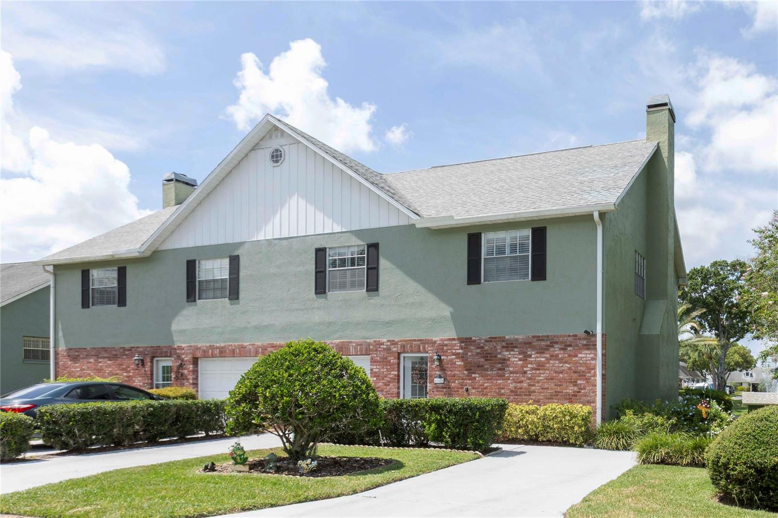 Welcome to your exclusive retreat in the highly sought-after Wilds Condominiums, a hidden gem situated at the heart of New Port Richey’s best-kept secret. This exceptional two-story condo offers an incredible blend of comfort and style, featuring 2 spacious bedrooms, 2.5 well-appointed bathrooms, an extra parking spot, and an expansive 1,796 square feet of living space. The added convenience of a one-car garage and an in-home laundry room enhances the practicality of this residence, with such features being a rare find in this community.
Imagine waking up each day to breathtaking water views of the peaceful pond that lies at the rear of your home, surrounded by lush landscaping that enhances the serene ambiance. This meticulously maintained residence not only provides modern comforts but has also been tastefully updated to create a warm and inviting atmosphere. Upon entering, you are greeted by a spacious living area complete with a cozy fireplace, adorned with newer tile floors that offer both style and easy maintenance. A compact yet functional kitchen. The utility room is equipped with a state-of-the-art smart washer/dryer combo, perfect for your everyday laundry needs. A charming half bath adds a touch of character, while sliding glass doors invite you to a tranquil patio, where the soothing sound of the pond's fountain creates a perfect backdrop for relaxation. The upstairs layout promotes a harmonious flow throughout the home, balancing both privacy and connection. The well-designed kitchen features rich wooden cabinets, granite countertops, and ample counter space, making meal preparation a delight. Equipped with modern appliances, the kitchen offers an enjoyable cooking experience and includes an inviting eat-in dining area, perfect for meals with family and friends. The primary suite serves as a true retreat, featuring a generously sized walk-in closet and a private en-suite bathroom, ensuring your personal space is both comfortable and functional. The second bedroom, conveniently located at the back of the home, is ideal for guests but can also easily serve as a productive home office, with the hallway bathroom nearby for added convenience. Recent upgrades elevate your enjoyment of this home, featuring elegant tile flooring, a high-efficiency tankless water heater, a high-tech washer/dryer combo, a new A/C unit all installed in 2023, and a refrigerator installed just two months ago. The Wilds Community boasts one of the lowest condo fees at $403 per month, covering roof maintenance, cable TV, high-speed internet, access to a heated pool, and more for maintenance-free living. Entering the Wilds community, you’ll find a charming barn-covered bridge leading to a vibrant lifestyle. This 55+ condominium community offers amenities like a swimming pool, bocce ball courts, exercise bikes, and event rooms for activities. Enjoy nearby downtown with live theater, diverse restaurants, and local artisan shops. Outdoor enthusiasts will appreciate the Cotee River for biking and canoeing, along with access to parks and seasonal music festivals. Golfers and beach lovers will enjoy the proximity to stunning courses and beaches along the Gulf Coast. This condo is your gateway to a vibrant lifestyle!