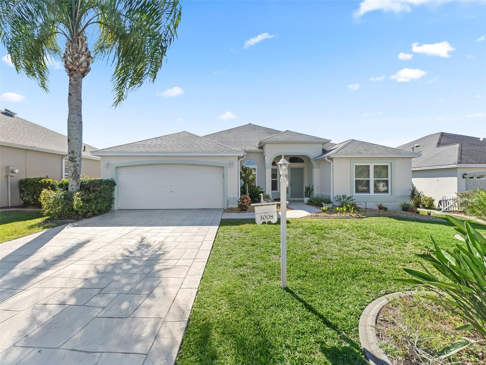 RENT BEFORE YOU BUY!!! This 3-bedroom, 2-bathroom home in The Villages includes a gas golf cart and is designed for function and convenience. The kitchen has a gas stove and a table for four. The dining room seats six, and the living room includes comfortable seating and a Smart TV. The enclosed Florida room offers a quiet space for coffee or reading. The master bedroom includes a king-size bed, ensuite with double sinks, a glass walk-in shower, and a large closet. Two guest bedrooms have queen beds and share a bathroom with a tub/shower combo. An indoor laundry room is also included. Nearby, access the Tall Trees Adult Pool, El Santiago Family Pool, and El Santiago and Hacienda Hills 9-hole executive golf courses. Evenings features live music and happy hour at Lake Sumter Landing and Spanish Springs.
July-October: $2790/month | November: $3450 | December: $3720 (all plus taxes & fees) PLEASE CALL FOR PEAK SEASON(JAN-MAR) & WEEKLY RATES