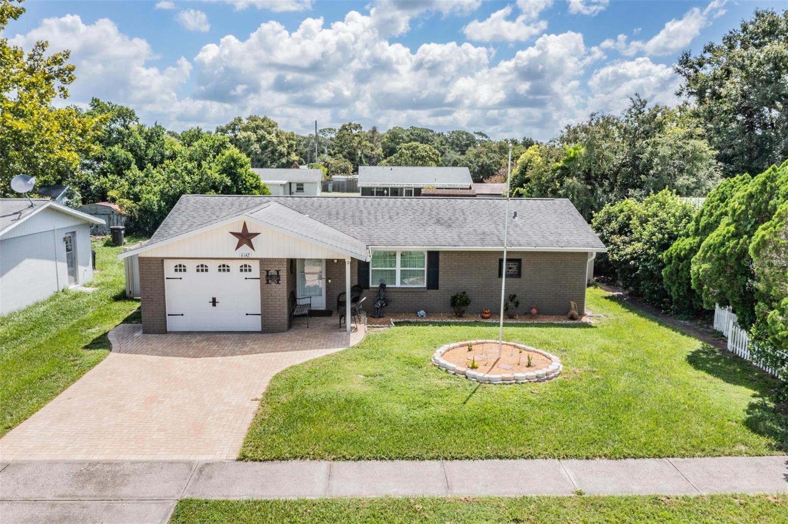 Step into comfort, style, and convenience with this immaculately kept Zephyrhills gem! Boasting an open-concept layout and quality craftsmanship in every detail, this beautifully updated home offers modern flooring, upgraded lighting, and stylish cabinetry throughout. Enjoy year-round relaxation in the finished lanai, or entertain guests in your massive, fully vinyl-fenced backyard—complete with a charming gazebo and dedicated grilling area. Nestled just minutes from schools, hospitals, parks, grocery stores, and downtown Zephyrhills, this home blends tranquility with unbeatable accessibility. A rare find with space, style, and location—come see it before it’s gone!