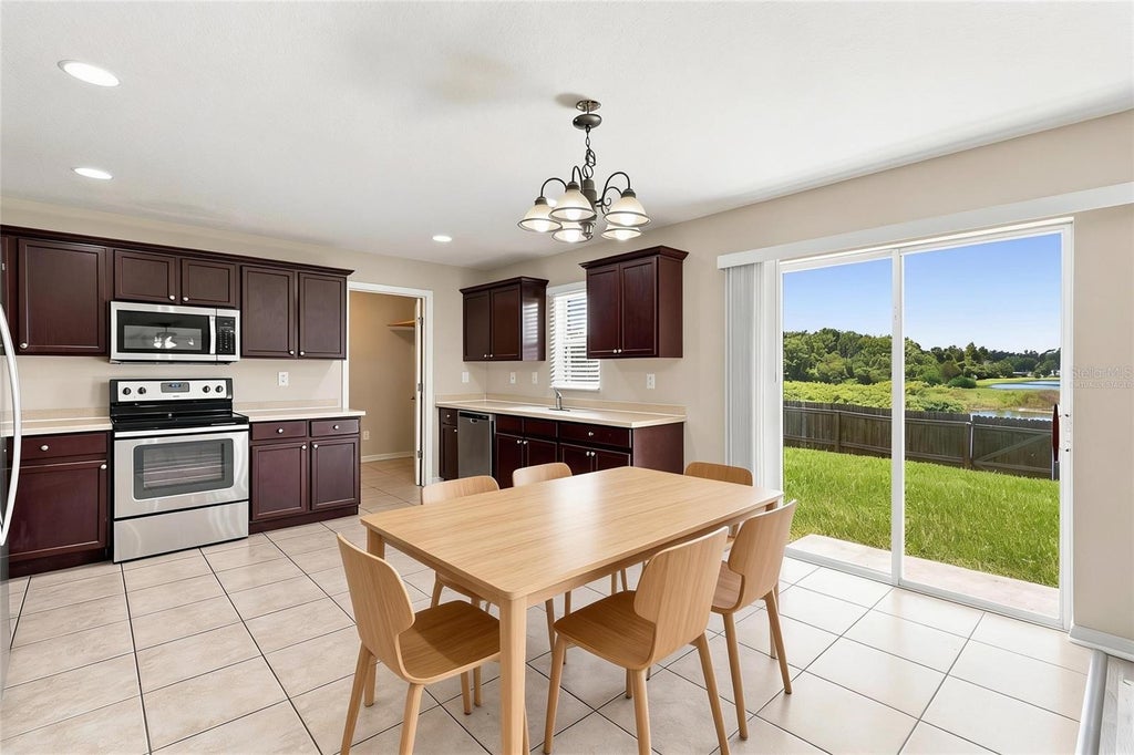 Photo of 5123 Cello Wood Lane, Wesley Chapel, FL 33543 (MLS # O6437778)