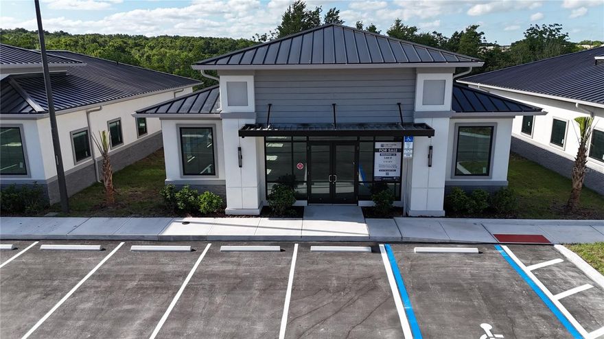 Under Construction. Building #12 is available for purchase at Lake Carter Exchange, a distinguished mixed-use development in Apopka’s East Shore at the intersection of Ocoee-Apopka Road and W Keene Road. This dark gray shell building is ideal for medical or professional offices, with potential for retail use based on buyer needs. The shell delivery offers full flexibility for custom interior design. The development is strategically located less than one mile from Advent Health’s seven-story, 120-bed hospital and opposite a new Publix Supermarket development. Situated in the vibrant East Shore trade area, which includes 5,000 planned residences and an average household income above $100k, this Class A property is perfectly positioned for businesses targeting growth in Central Florida’s second-fastest-growing city. Contact us for pricing details/incentives and to schedule a tour of this exceptional commercial opportunity.