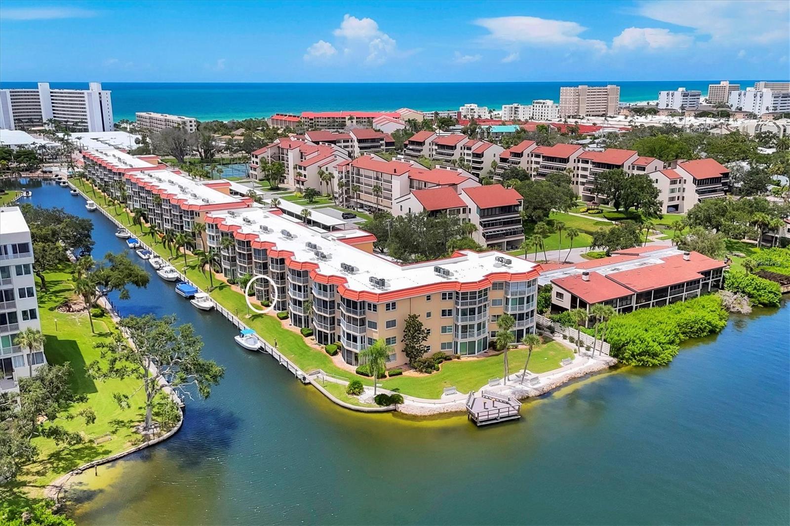 SIESTA HARBOR...55+...BEAUTIFUL CANAL & Intercoastal Water Way with incredible views of boats idling by and BEACH ACCESS. BRING YOUR BOAT up to 30' because it only costs $1,000 ANNUALLY to berth your boat! BUT WAIT till you see this TOTALLY RENOVATED BEAUTIFUL 1 bedroom 2 full bathroom condo! NEW, NEW, NEW...everything is new...Ceramic tile flooring, baseboards, interior doors & hardware, impact windows throughout, Popcorn removed and new texture ceilings, New electric plugs and switches, new kitchen with floating cabinetry, Quartz counters, new appliances, High end and modern lighting fixtures throughout, updated bathrooms also with floating vanities, incandescent lighting mirrors, new shower, New hot water tank, HVAC is only 2 years old, etc. You have plenty of storage as the bedroom has 2 closets (one is walk in), linen closet, Hall coat closet, pantry closet AND just outside your front door is a storage room for your bikes etc.! Amenities include a beautiful pool overlooking the water, shuffleboard, rec center, pier for boat watching and gatherings, tandem boat docks, fitness center FREE laundry on 2nd, 3rd and 4th floors PLUS FOB access to the beach across the street @ Crescent Arms. ALSO you have one DESIGNATED covered carport parking spot with plenty of guest parking #537. Outdoor grilling SPOT. Rental friendly but no pets except authentic guide dogs. PRICED BELOW MARKET AT $429,900