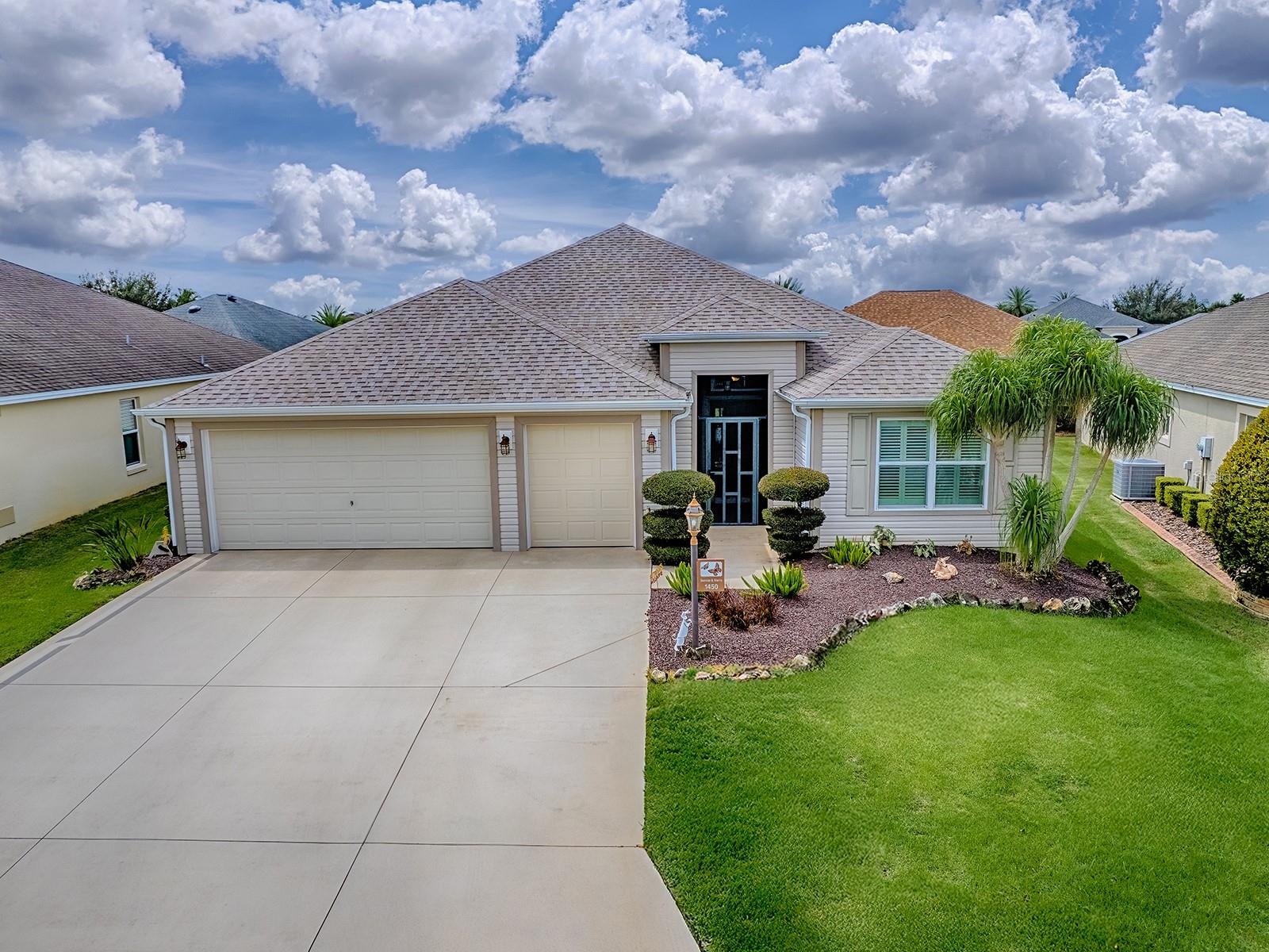 Well maintained 3 bedroom, 2 bath Designer Home with GOLF CART GARAGE located in The Village of Fernandina. Lovely Cul-de-sac homesite with 1925 sq ft of living space plus an Enclosed Lanai with mini split. Roof 2025! The Sunflower Model is designed for both comfort and entertainment, featuring an open floorplan concept, a Foyer Entry with Spacious Living Room/ Dining area, Vaulted & Textured Ceilings-no popcorn. The Wonderful Eat-in Kitchen has Wood Cabinets, Granite Counters & matching Backsplash, and a Breakfast Bar and is open to the Living/Dining area. The Sizable Primary Ensuite can accommodate your 'King' furniture and the Primary Bath has Double Sinks, plenty of cabinetry & a Tile Walk-in Roman Shower. The Two Guest Bedrooms (one with no closet) are on the opposite side of the home. One Bedroom has a built-in Murphy Bed giving you flexible space. The Guest Bath has a granite top vanity, and a tile shower/tub combo. From the main living area and through sliding glass doors is the enclosed lanai, complete with a mini-split A/C unit, making it the perfect space for entertaining or just relaxing. The Village of Fernandina is an exciting location for Villagers looking for great neighbors and good fun! The Bonifay Country Club is a favorite for golfers, and for those looking for a great place to dine. Neighborhood and Village recreation centers are close by, as is the Sarasota golf practice facility.