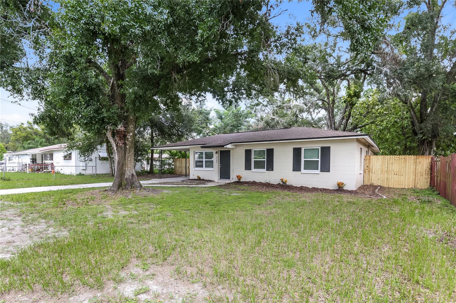 This 4 bedroom, 2 bathroom block home on over a 1/3 of an acre has everything you are looking for! Interior features include fresh paint, updated kitchen, updated vanities in the bathrooms, new LVP flooring in bedrooms, and more! Just outside, kick back and relax on the rear porch overlooking the deep lot that has brand new privacy fencing all the way around! Massive storage shed on property needs a little TLC but could serve multiple uses! No HOA so bring your RV, boat, trailer, etc! Located near the Seminole Hardrock Casino and State Fairgrounds with convenient access to I-4, I-75, and I-275 for ease of travel. Roof, AC, and water heater all replaced in 2016. Grab this one before it's gone!